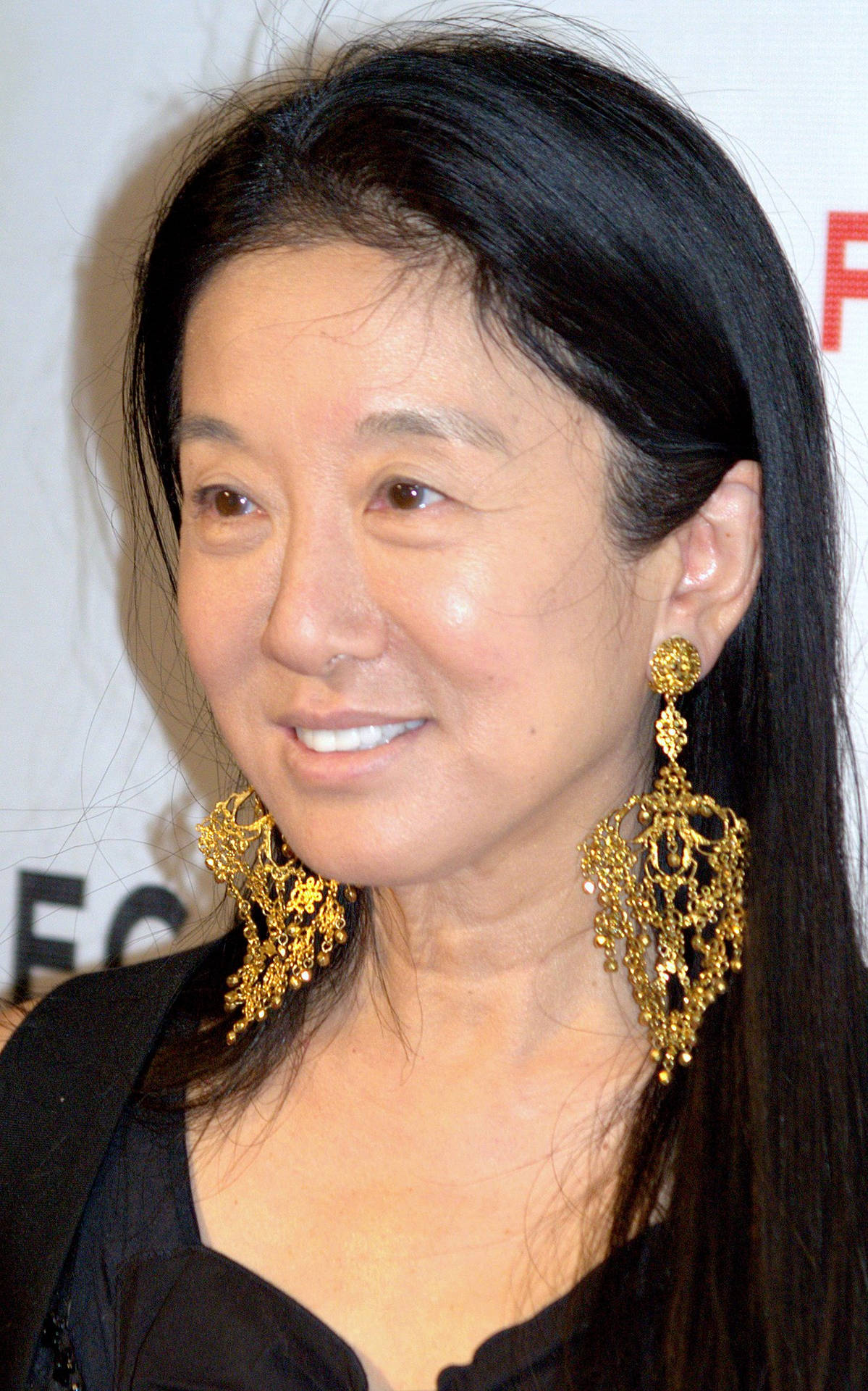 Vera Wang Wearing Gold Earrings Background