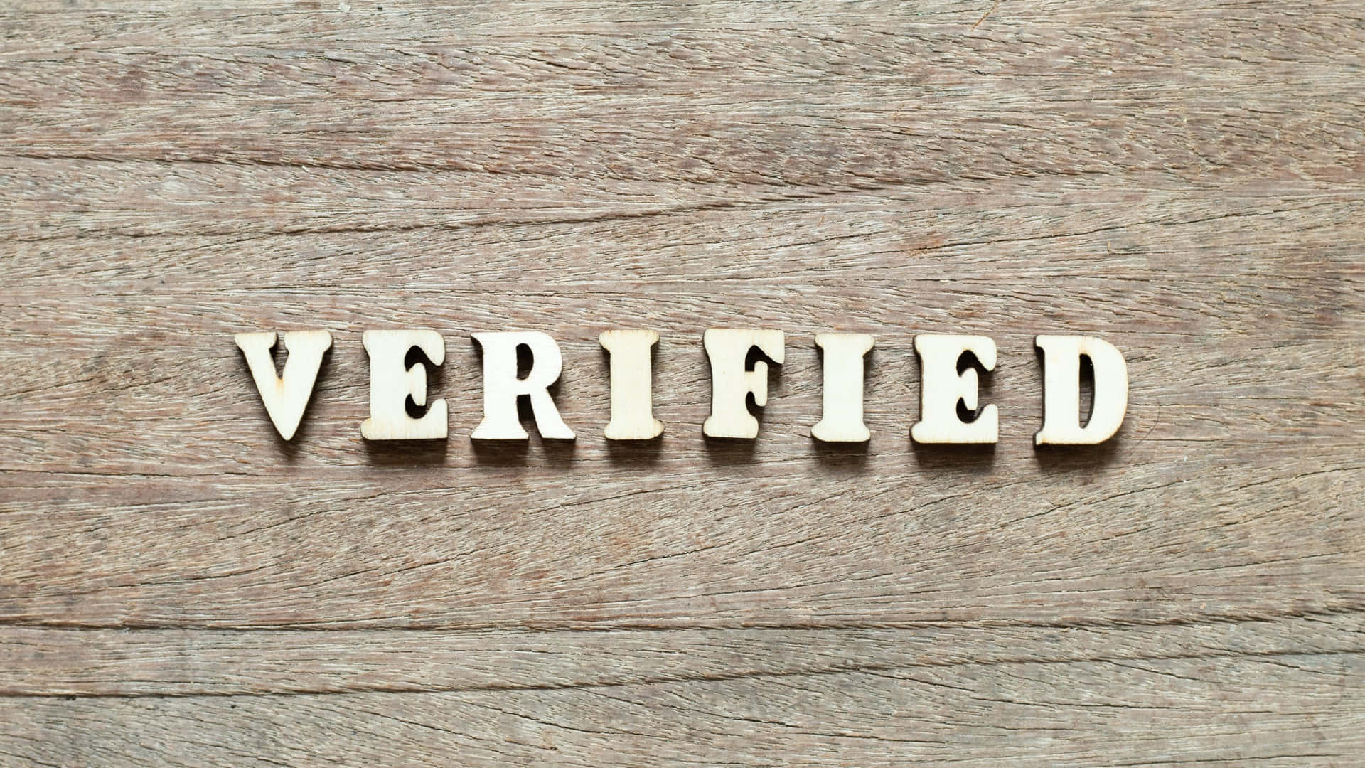 Verified Wordon Wooden Background