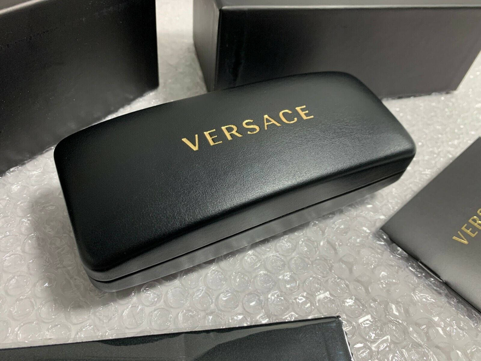 Versace Black Clamshell Case Background