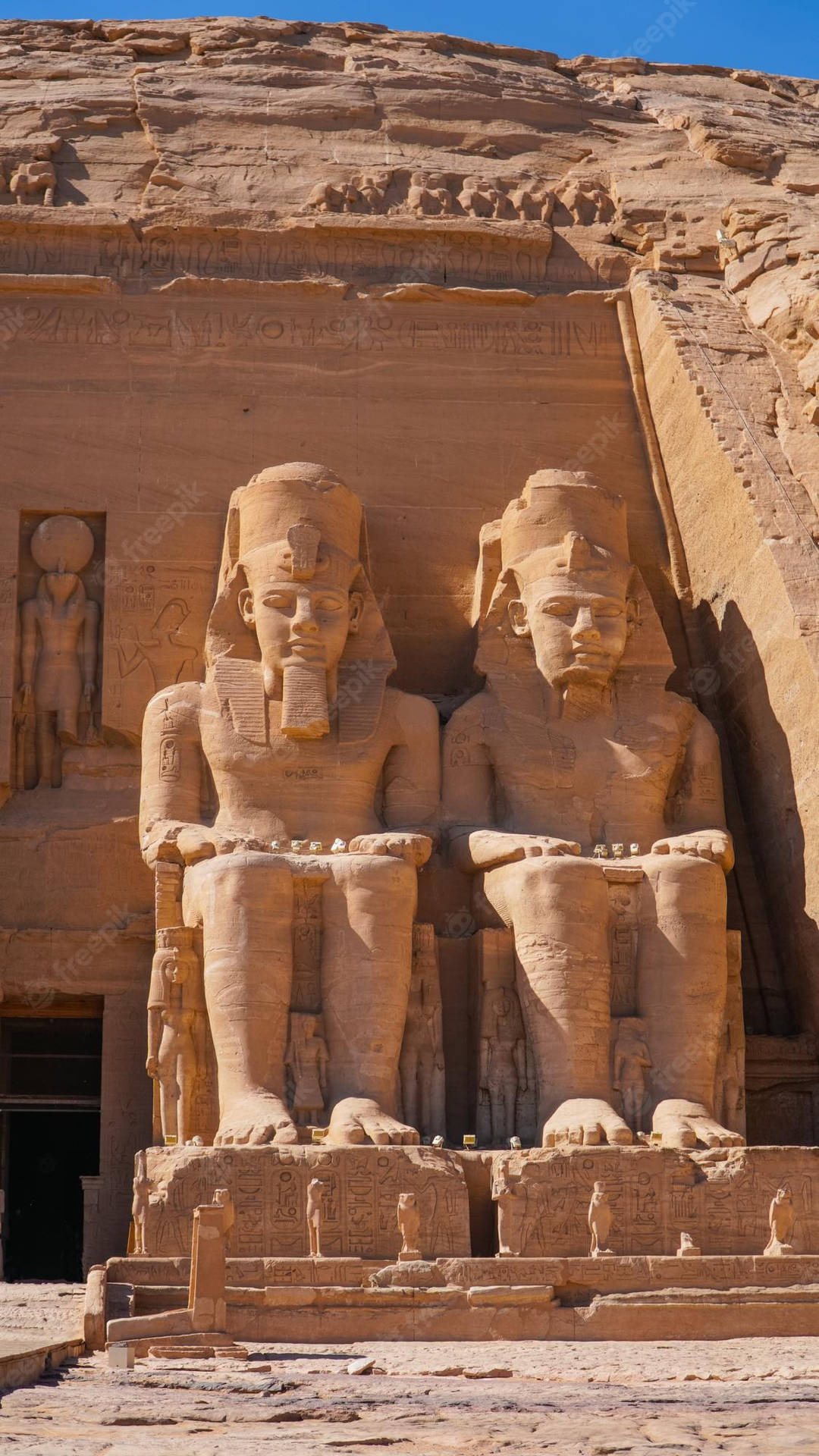 Vertical Photo Of Abu Simbel Temple's Statues Background