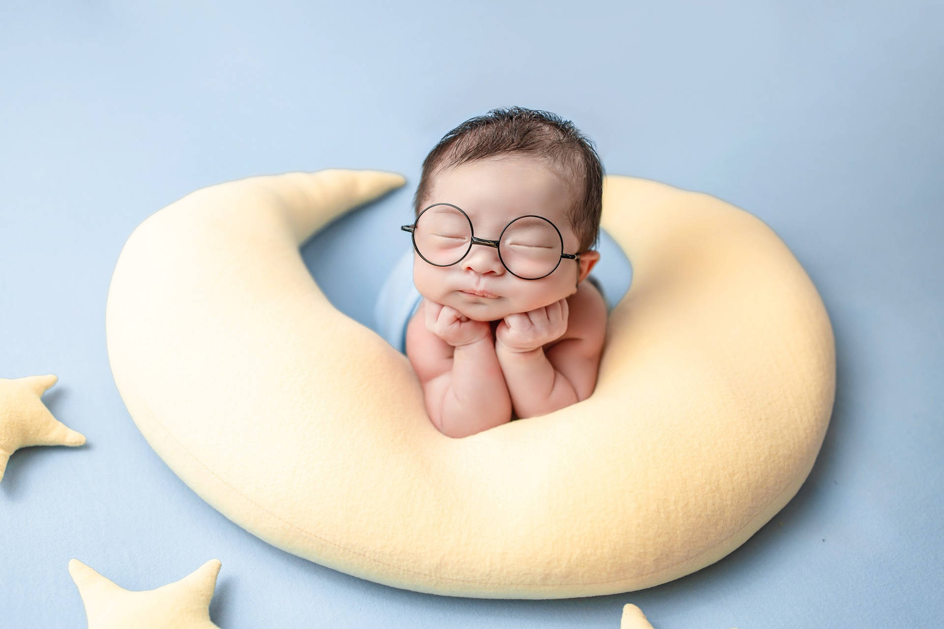 Very Cute Baby On Moon Pillow Background