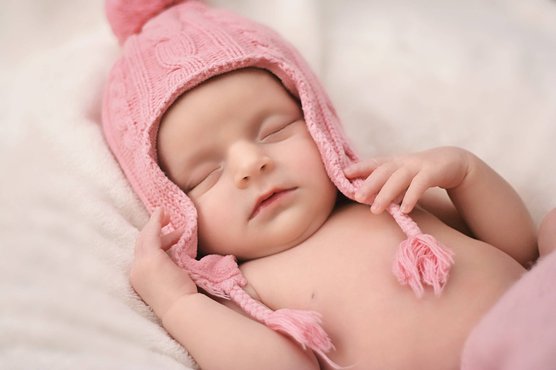 Very Cute Baby Pink Knitted Hat Background