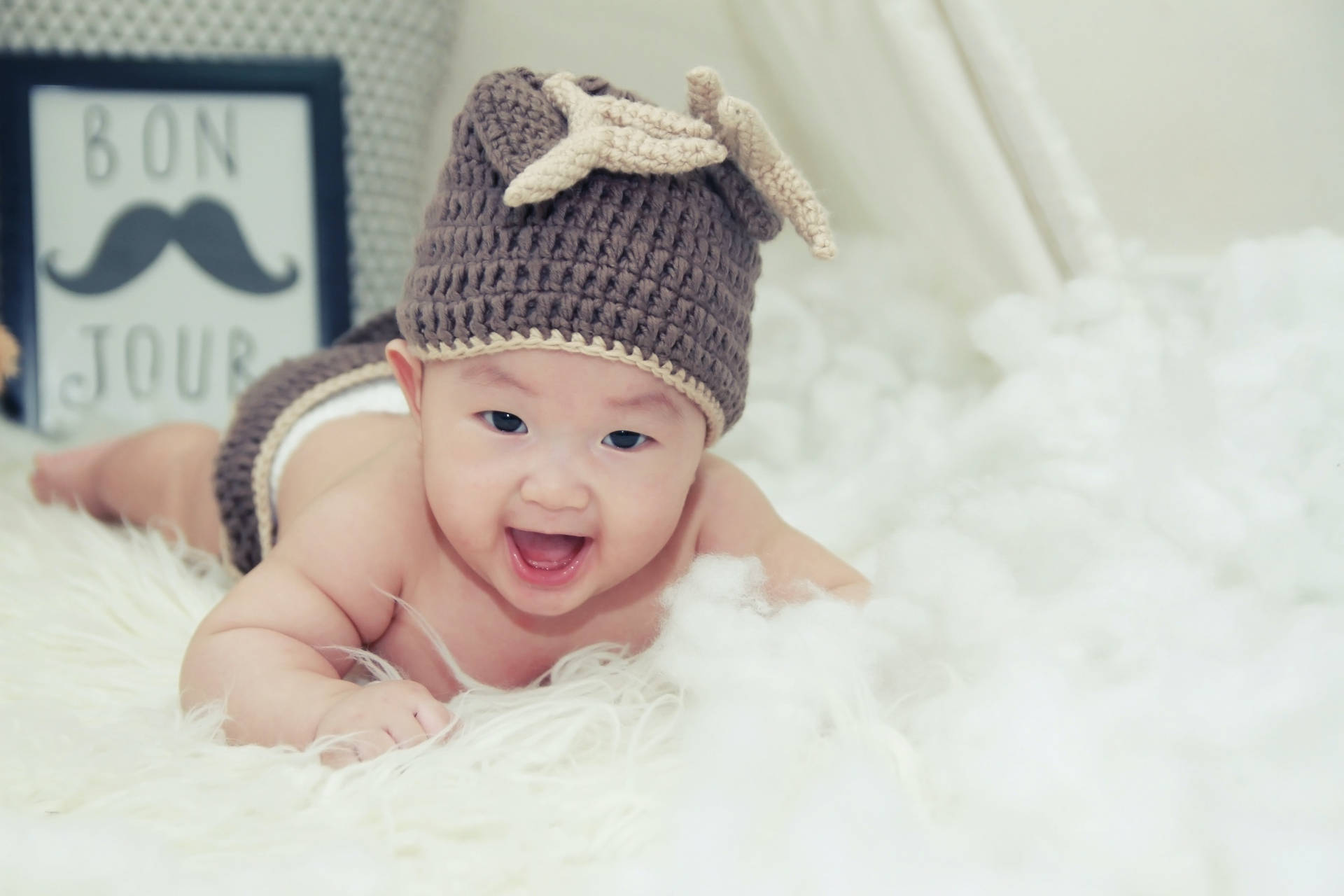 Very Cute Baby Wearing Beanie Hat Background