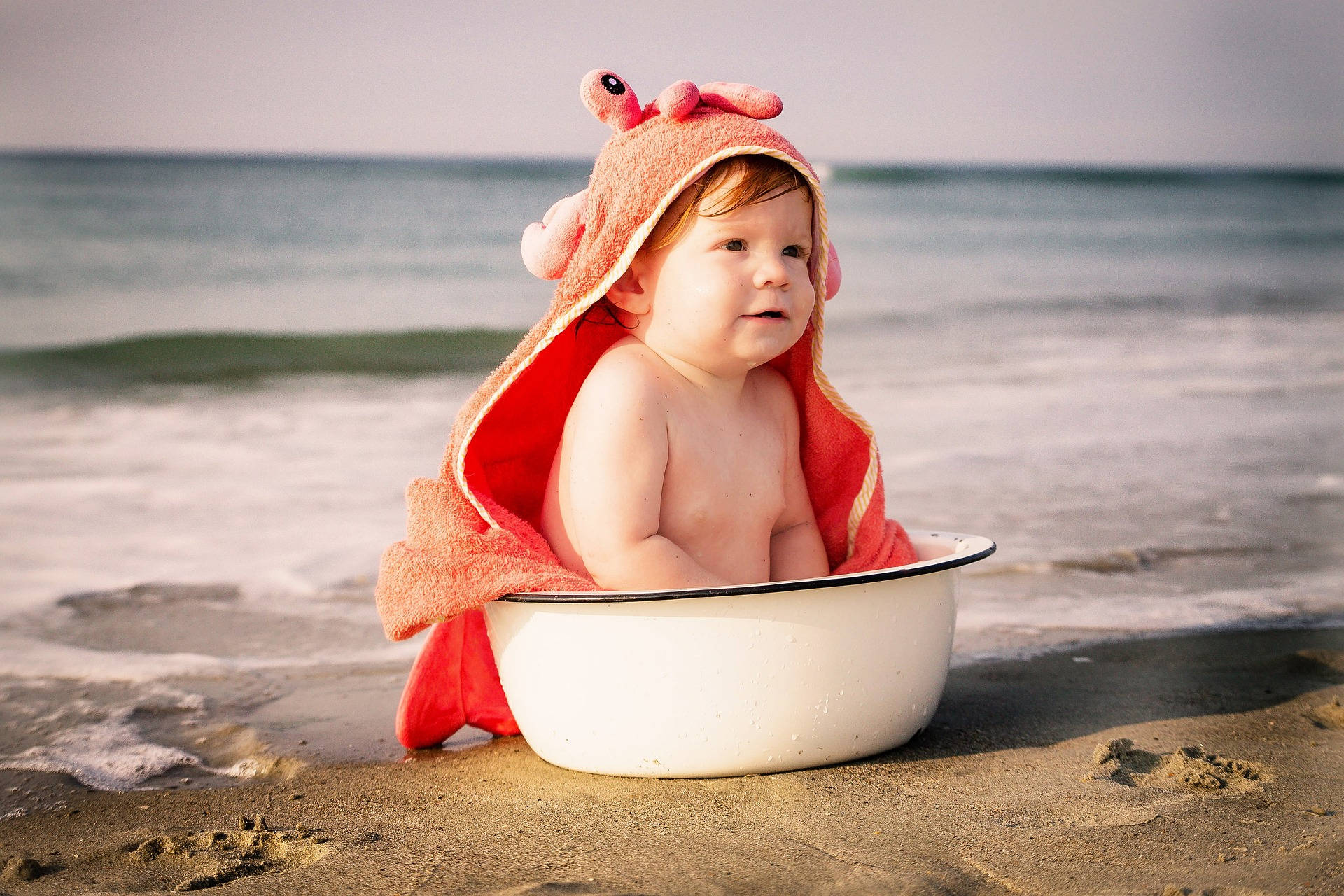 Very Cute Baby With Crab Towel Background