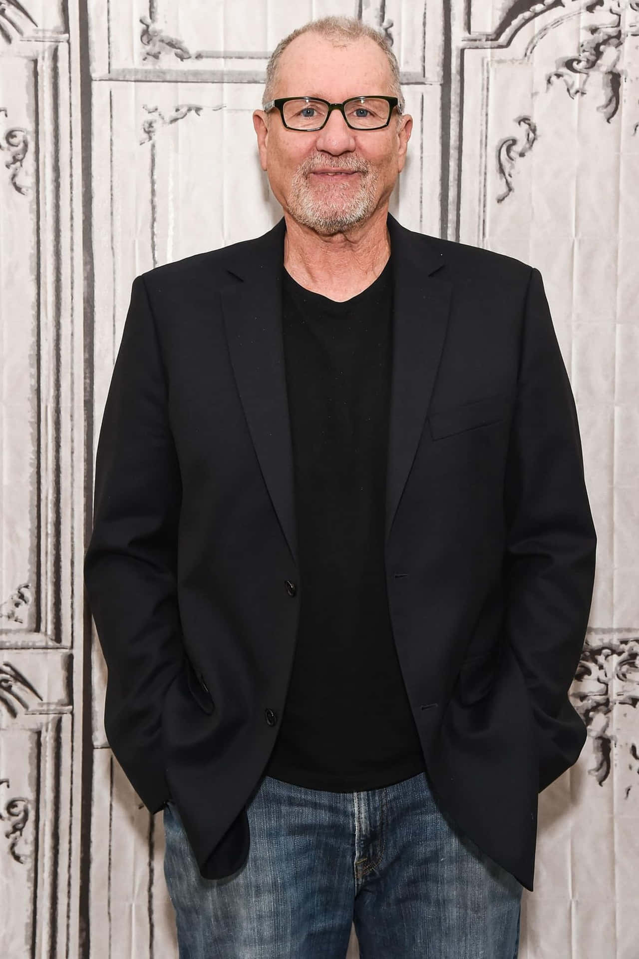 Veteran Actor Ed O'neill Posing In A Formal Suit Background