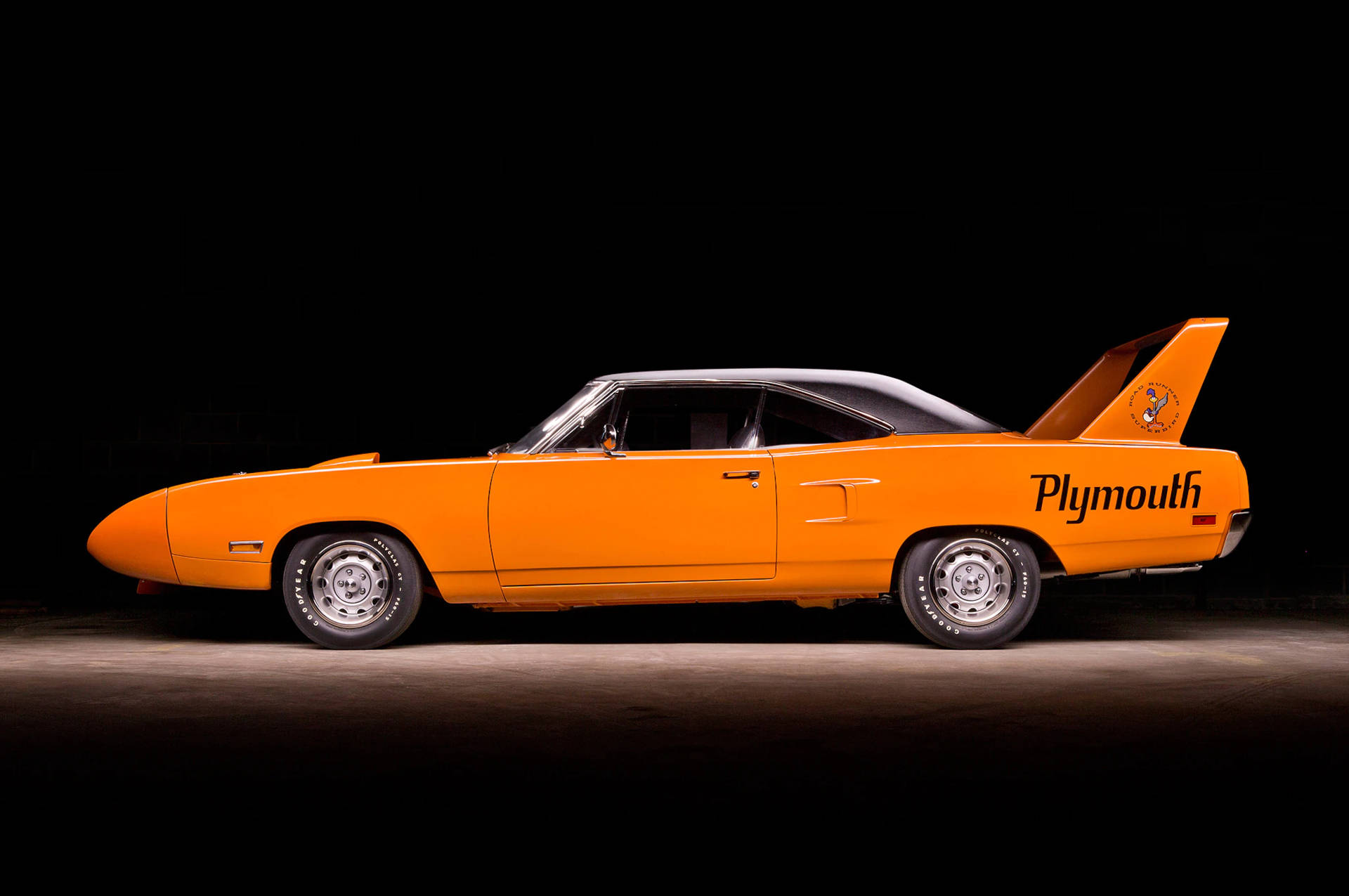 Vibrant 1970 Plymouth Superbird In Arresting Orange Background