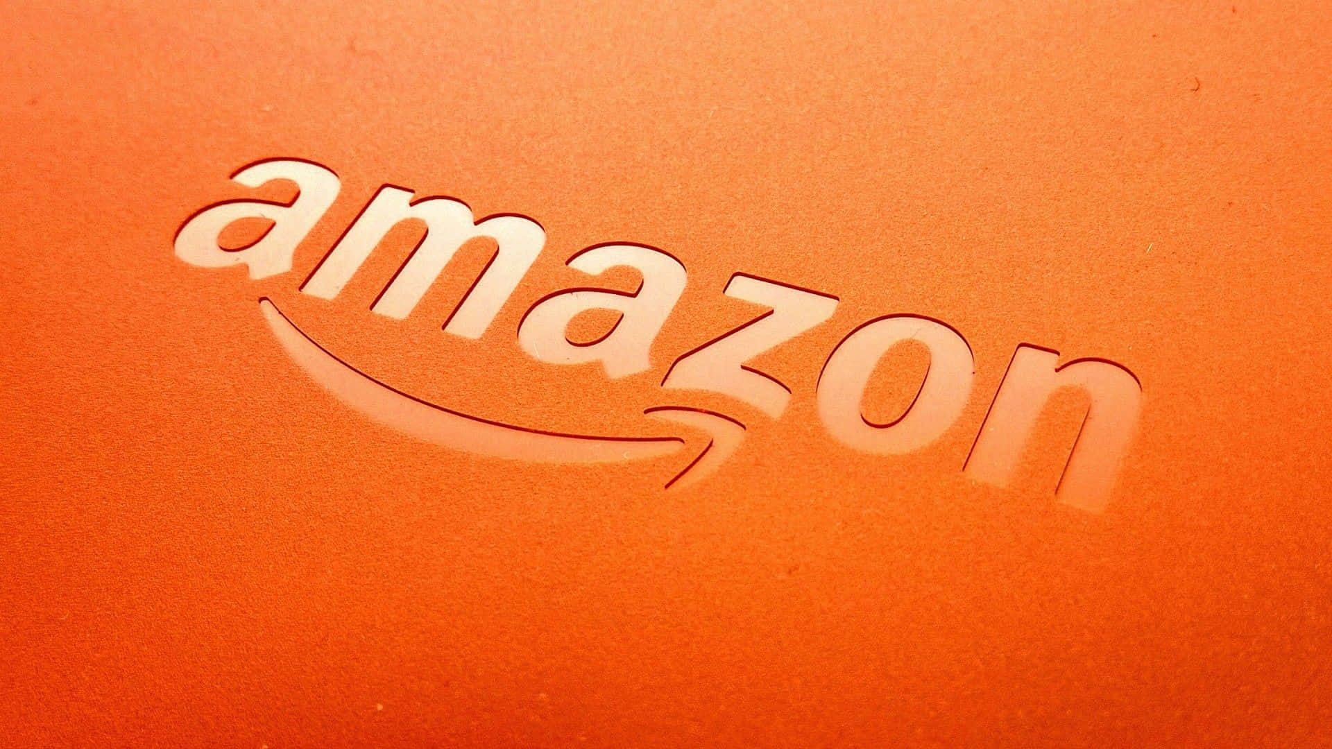 Vibrant Amazon Uk Logo Against A Stunning Orange Backdrop