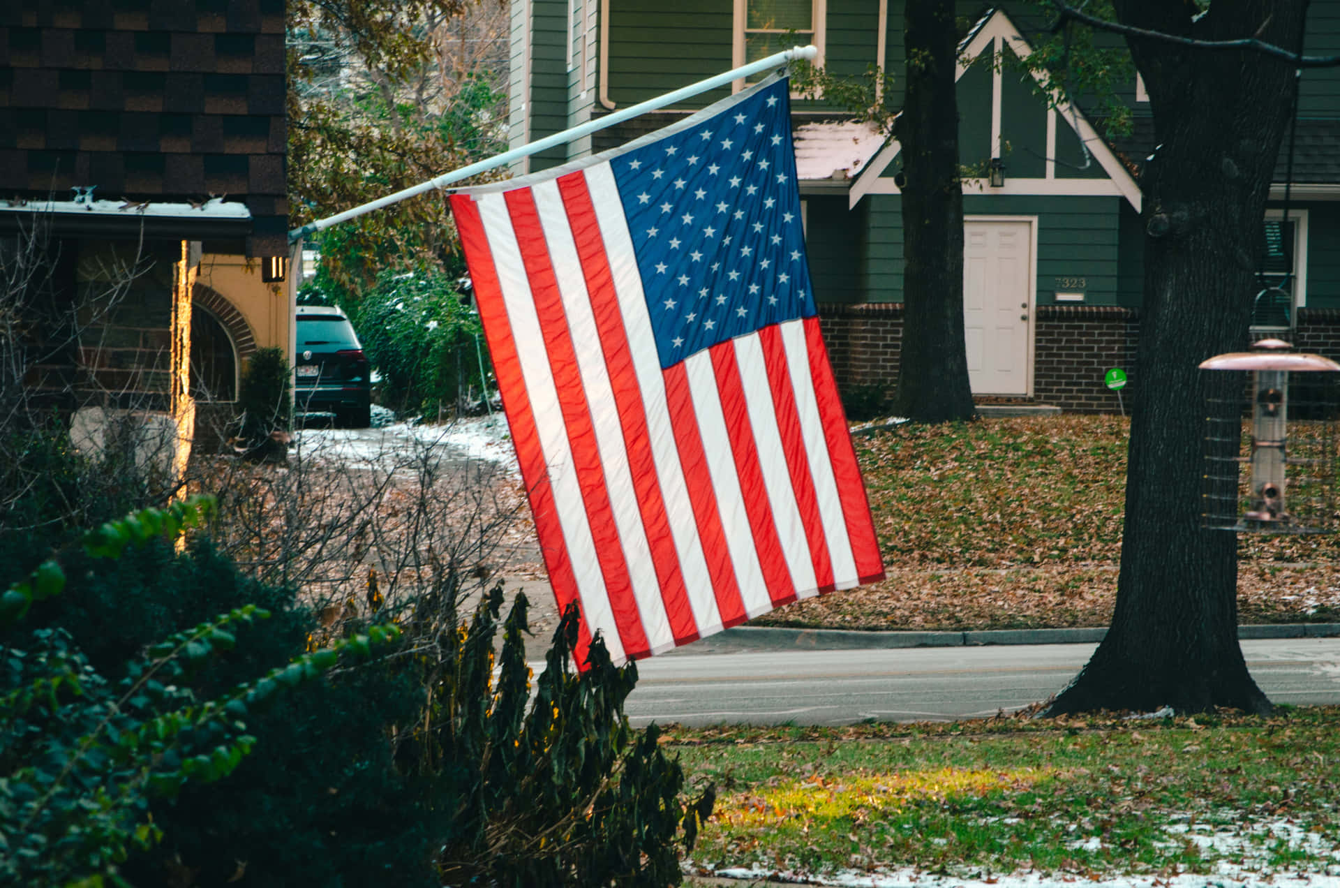 Vibrant American Flag Waving Against Blue Sky Background