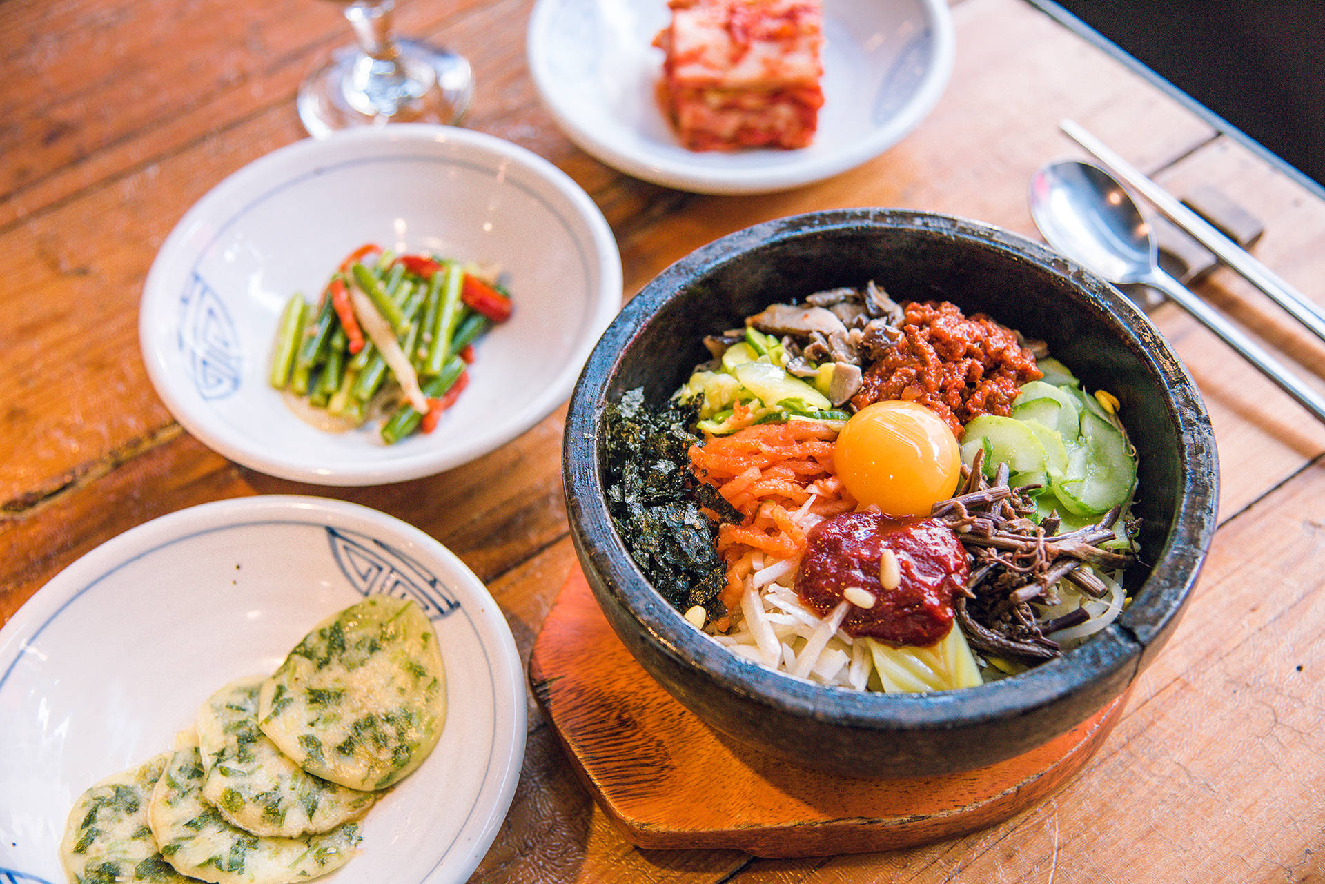 Vibrant And Delicious Bibimbap With Pajeon Meal. Background