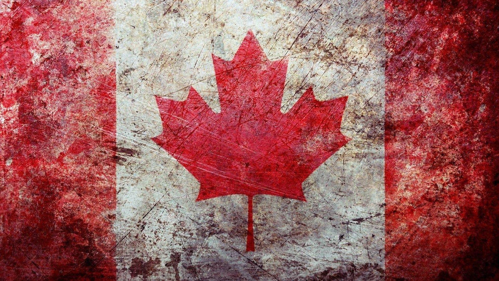Vibrant And Proud Canadian Flag Waving In The Wind Background