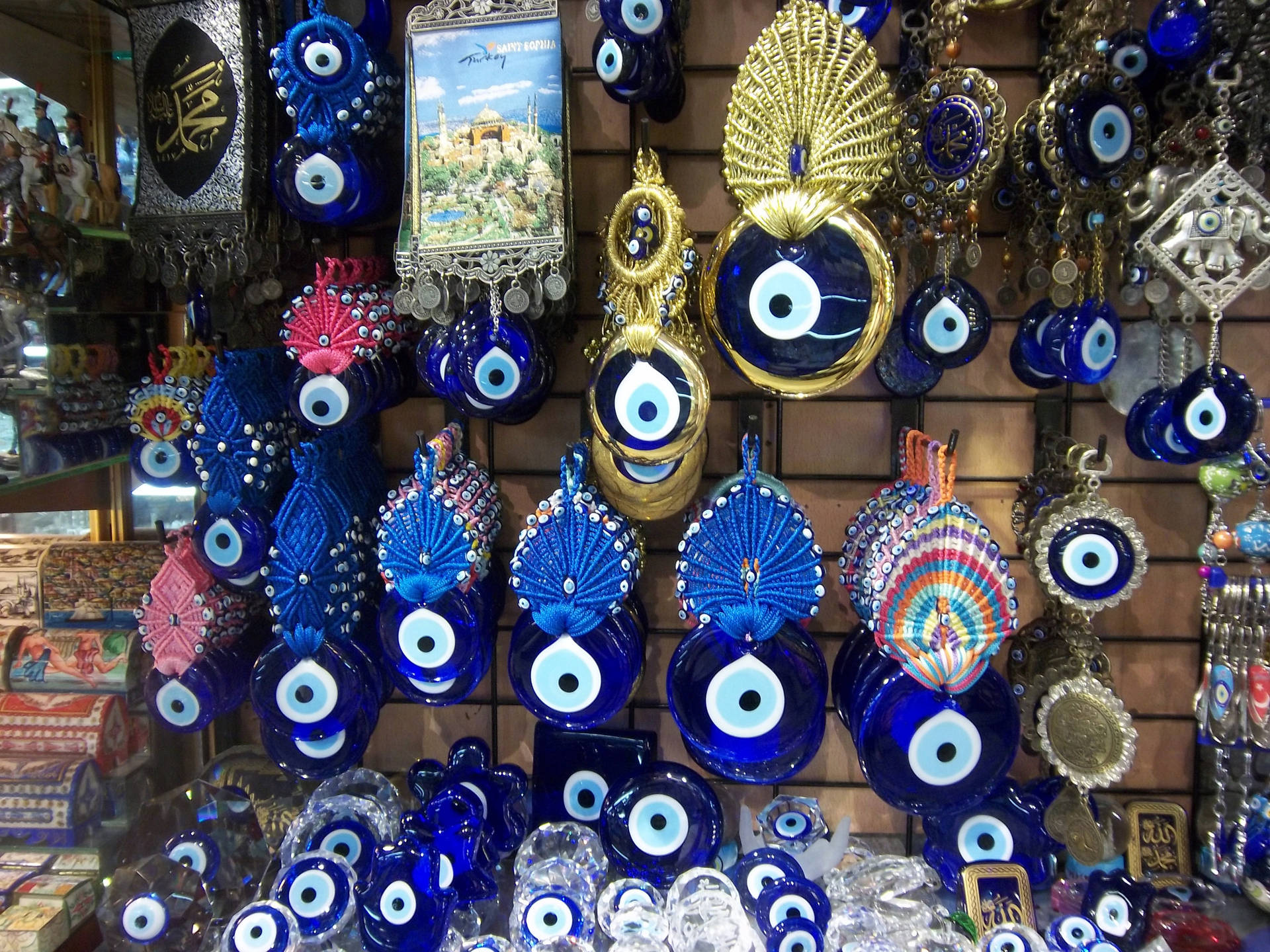 Vibrant Array Of Evil Eye Charms Hanging Against A Light Background Background
