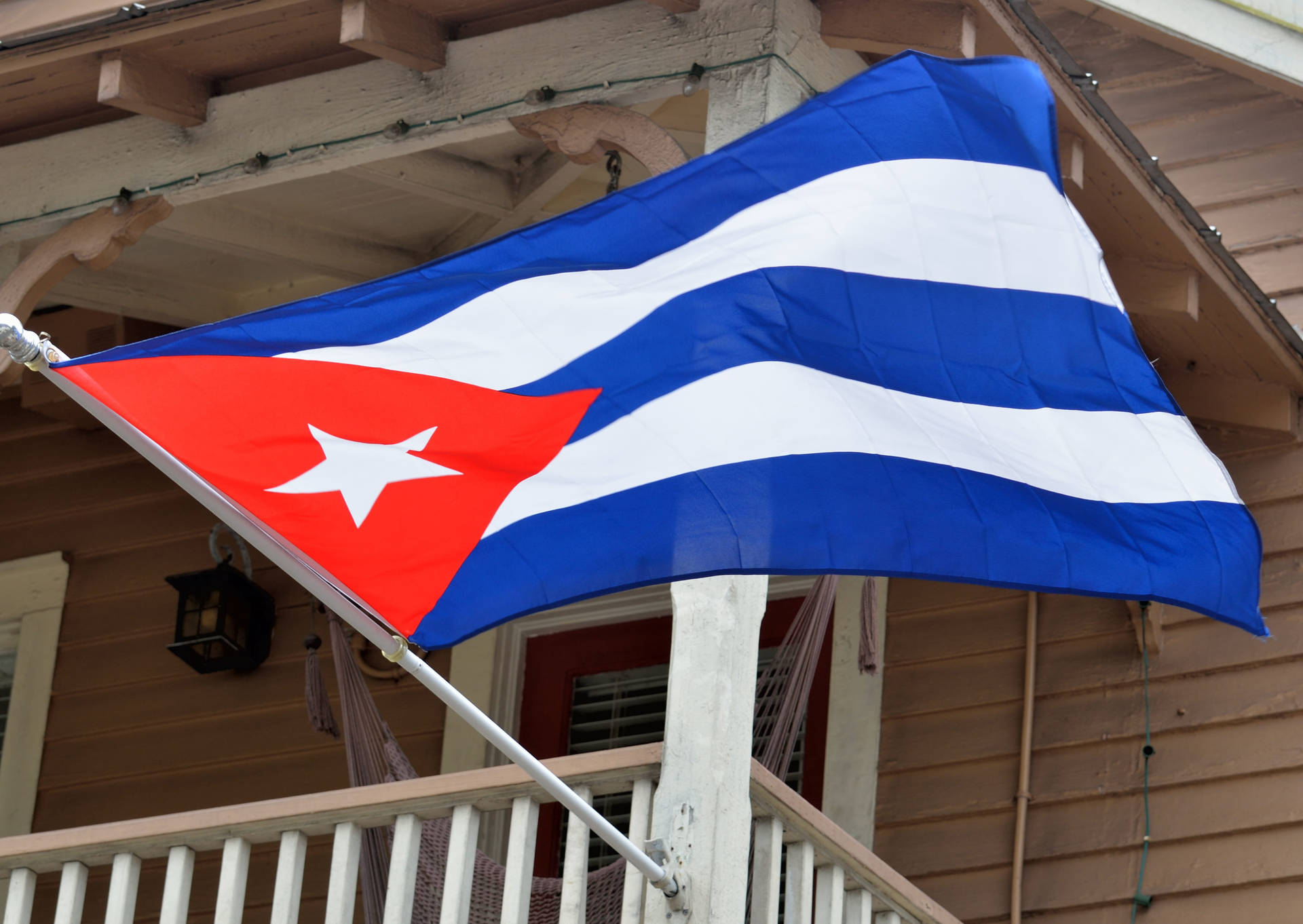 Vibrant Cuban Flag Fluttering In The Breeze Background