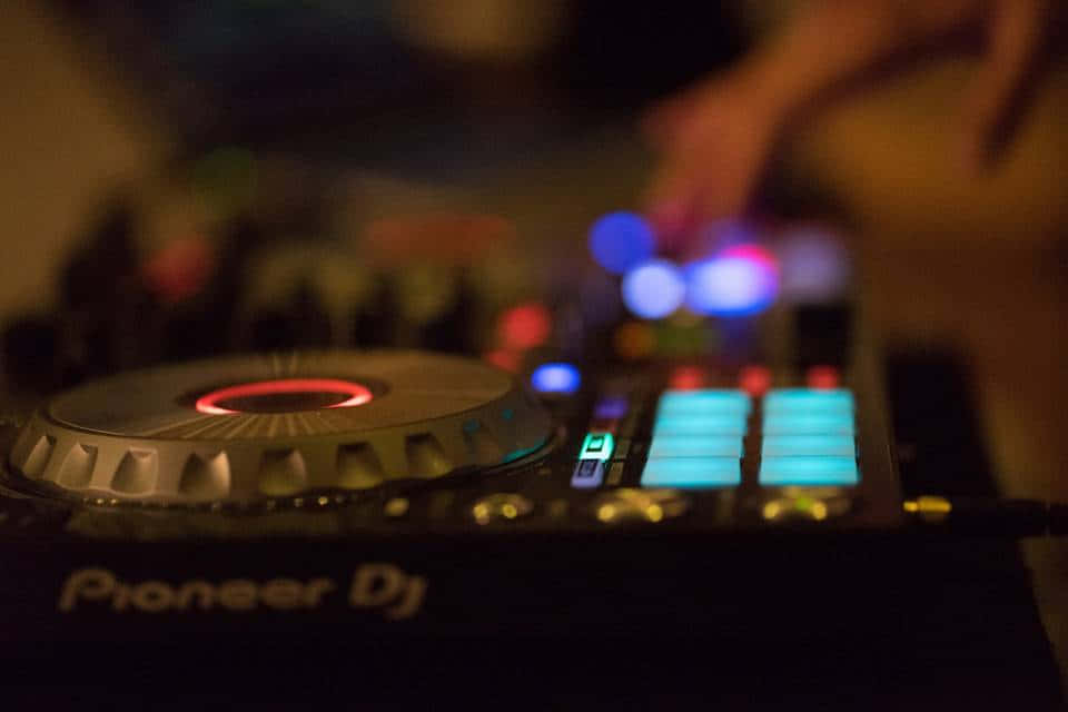Vibrant Dj Lights Illuminating The Dance Floor Background