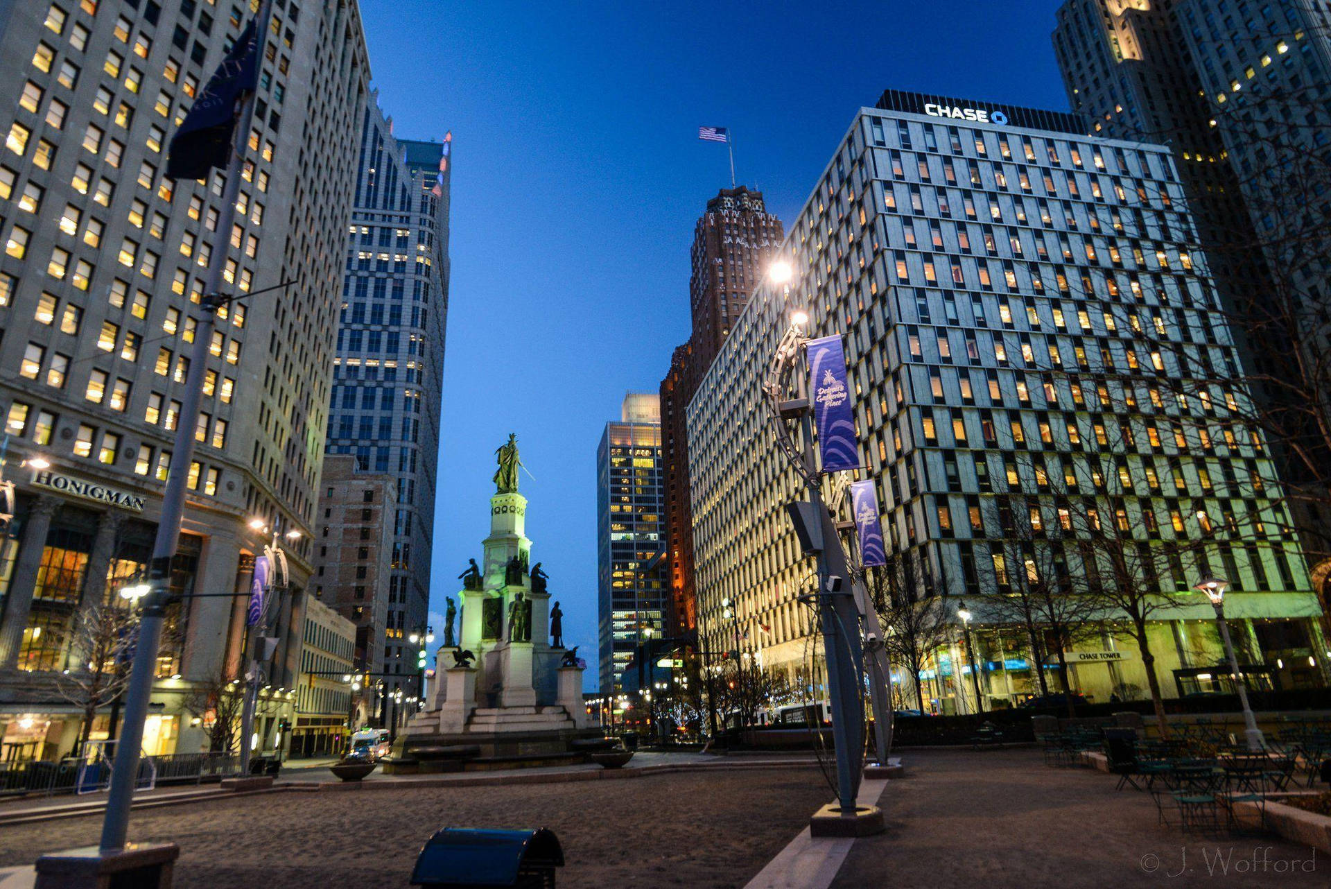 Vibrant Downtown Detroit Showcasing The Iconic Qube Monument Background