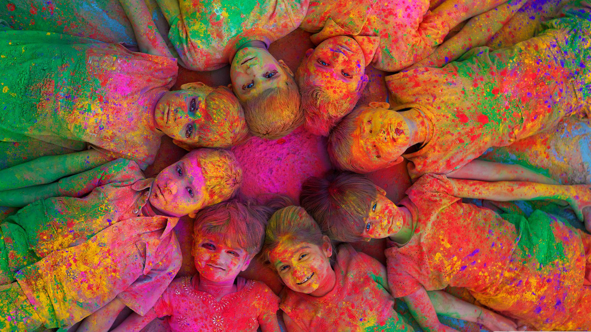 Vibrant Energy Of Holi - Children Enjoying The Festival Of Colors Background