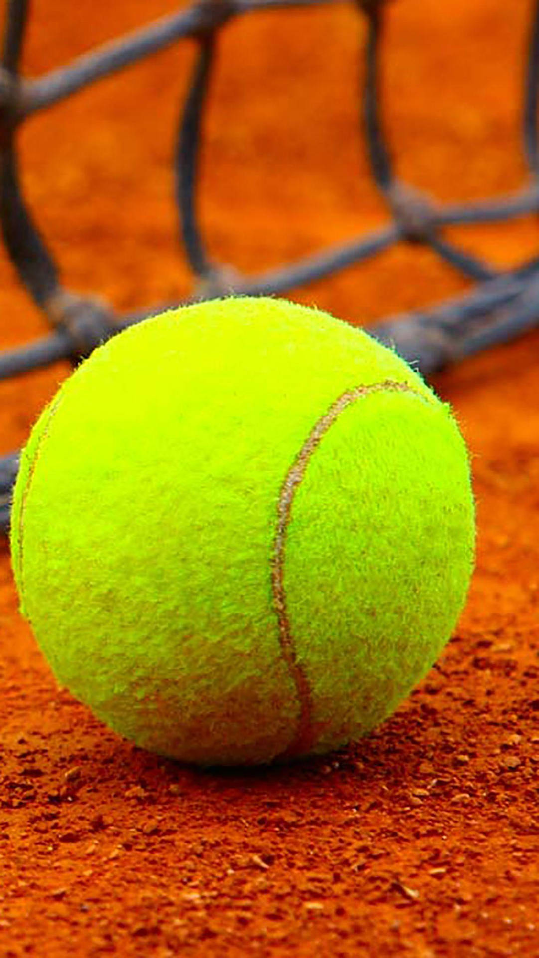 Vibrant Fluorescent Tennis Ball On Court Background
