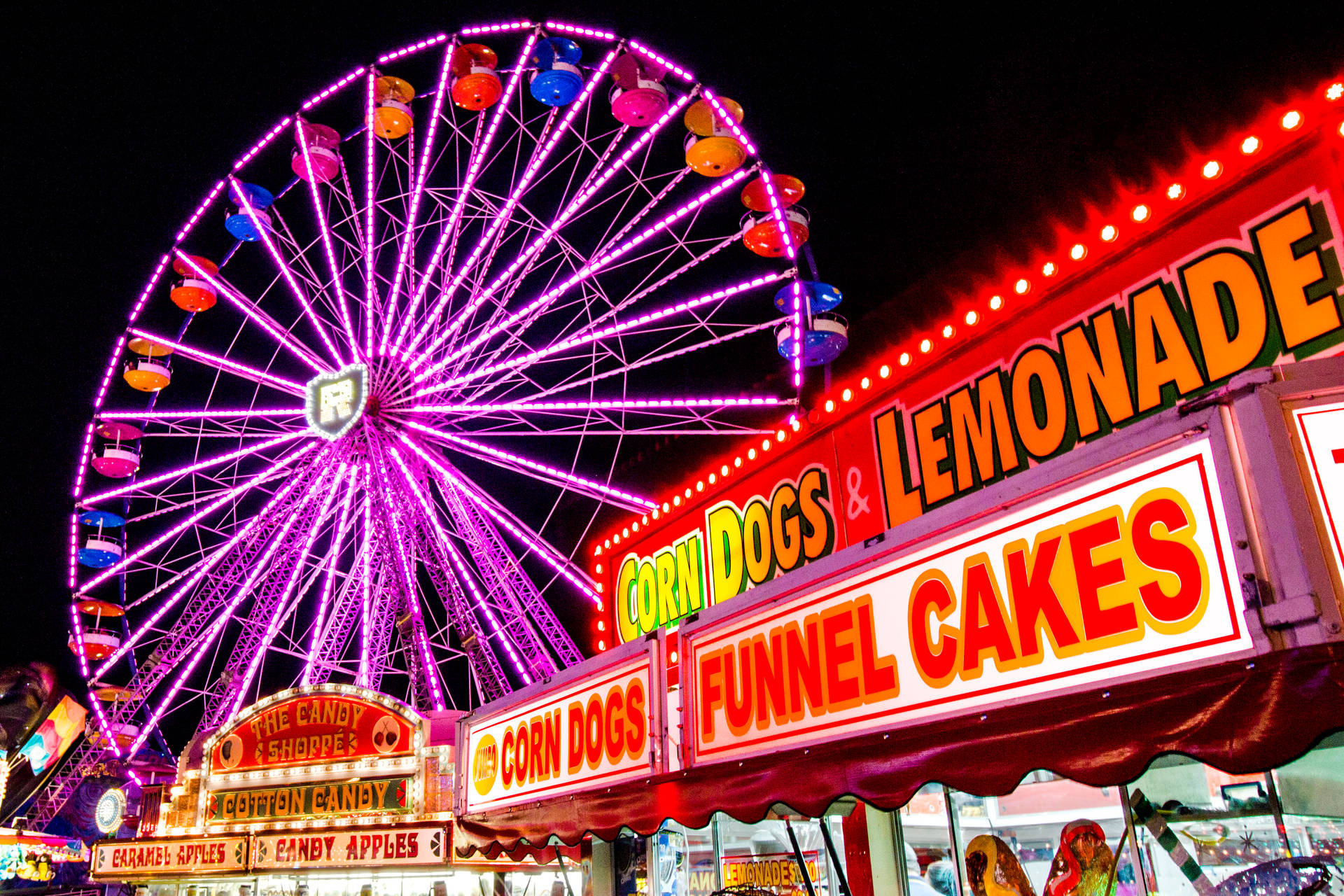 Vibrant Food Booths At The Annual Fair Background