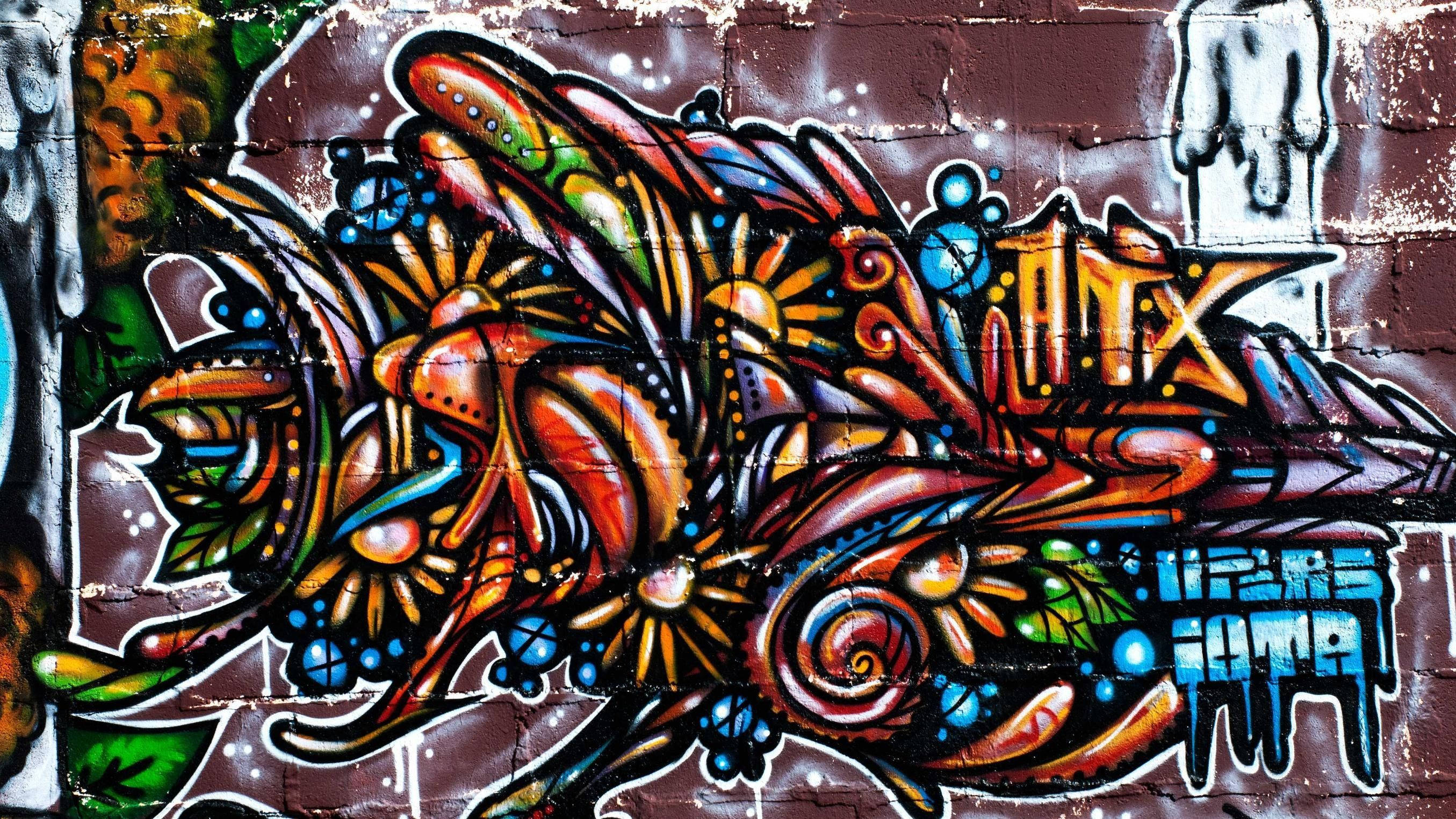 Vibrant Graffiti Flowers On A Laptop Background