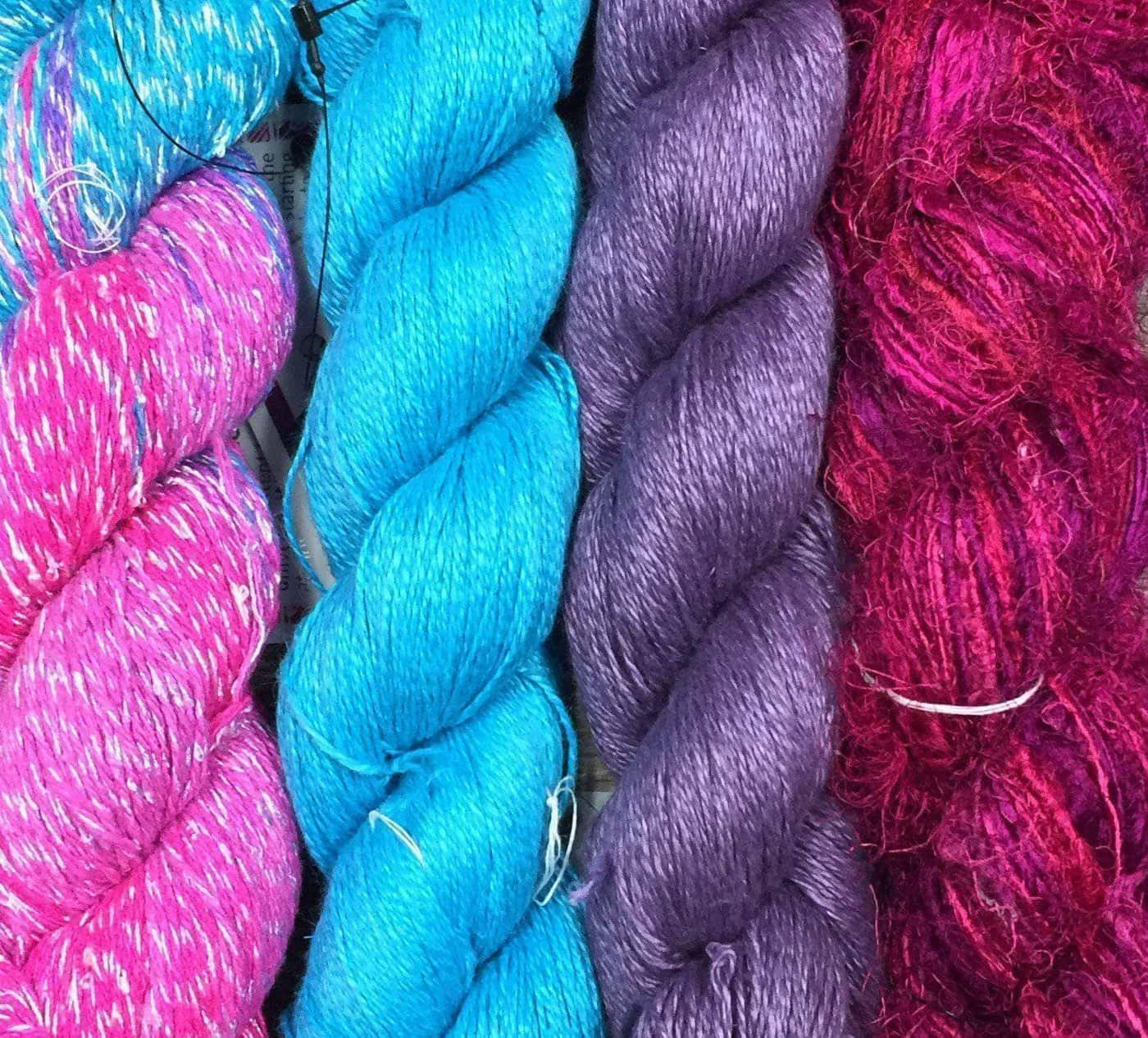 Vibrant Knitting With Spincycle Wools Background