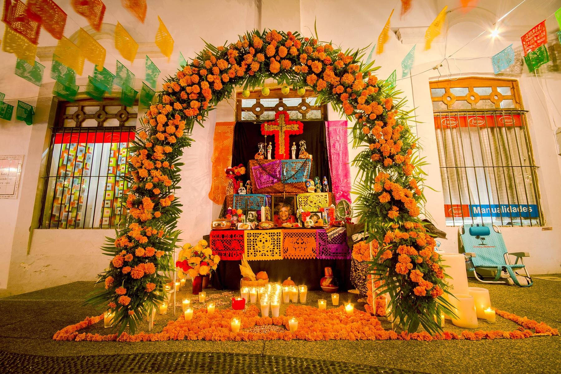 Vibrant Mexican Altar Adorned With Colorful Flowers