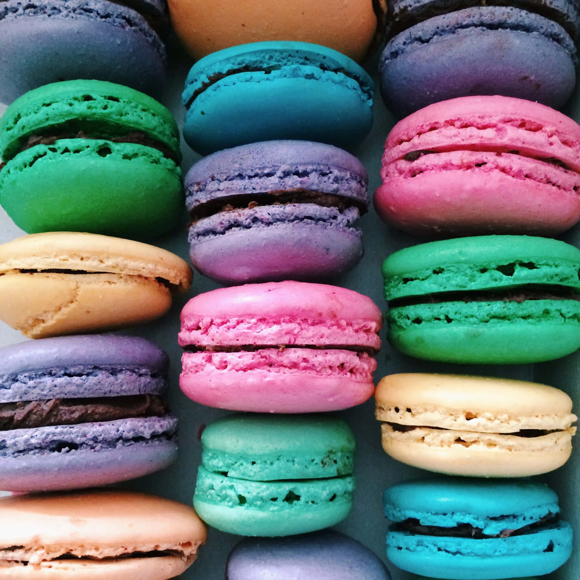 Vibrant Mixed Size French Macaron Background