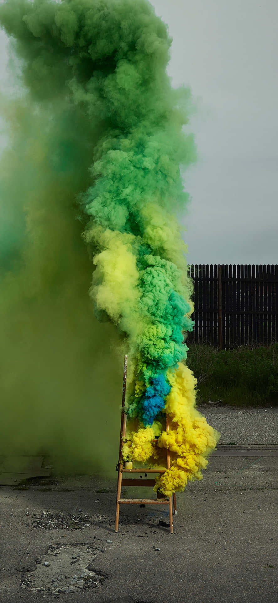 Vibrant Mixture Of Yellow And Green Smoke Background