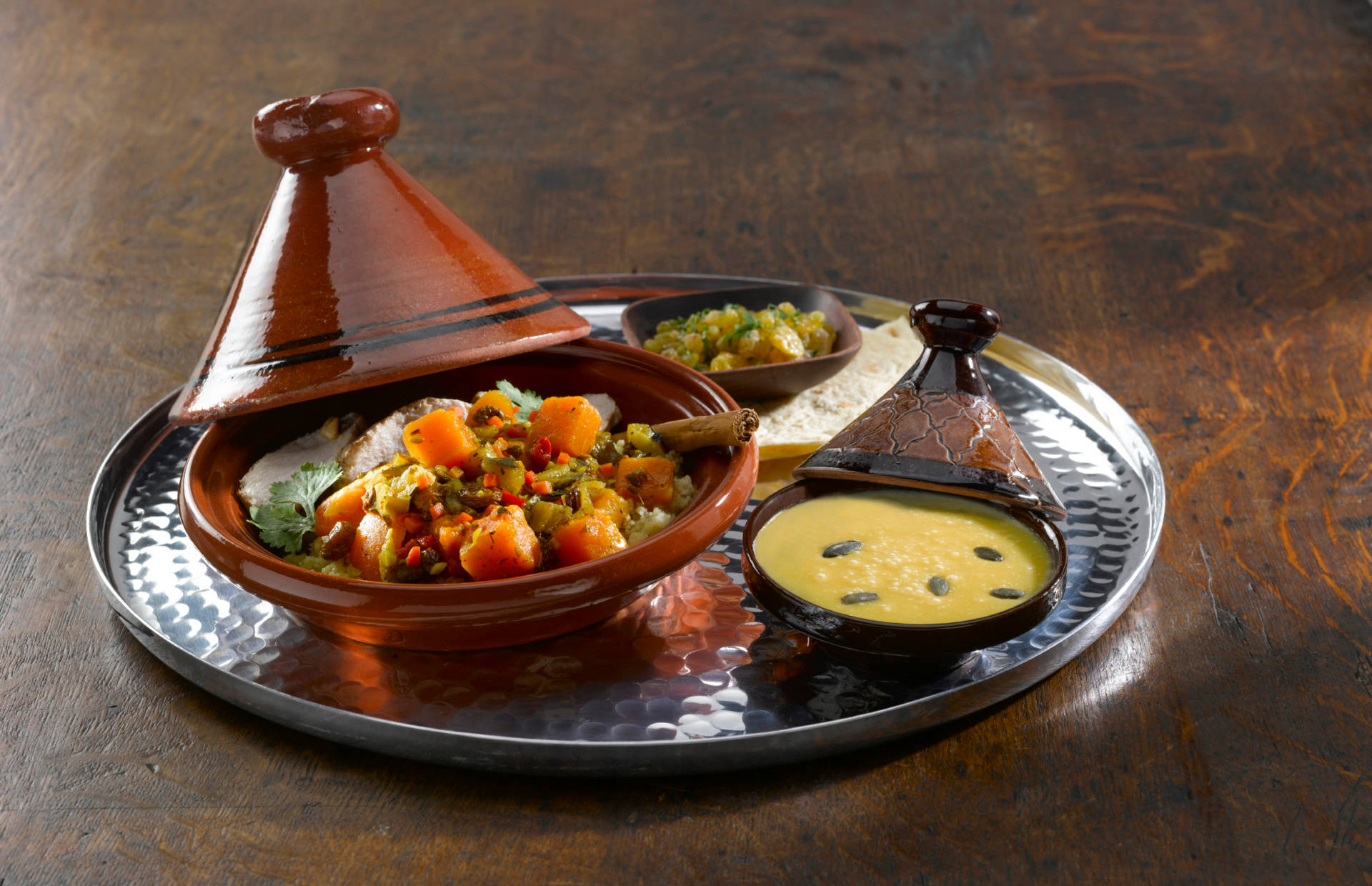 Vibrant Moroccan Vegetable Tajine Served Traditionally Background