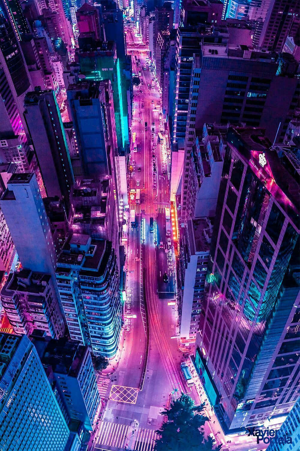 Vibrant Neon Pink And Blue Lights Dance Over A Shimmering Cityscape Background