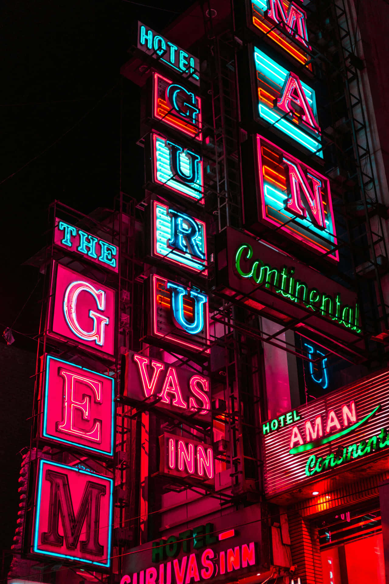 Vibrant_ Neon_ Signs_ Hotel_ Facades Background