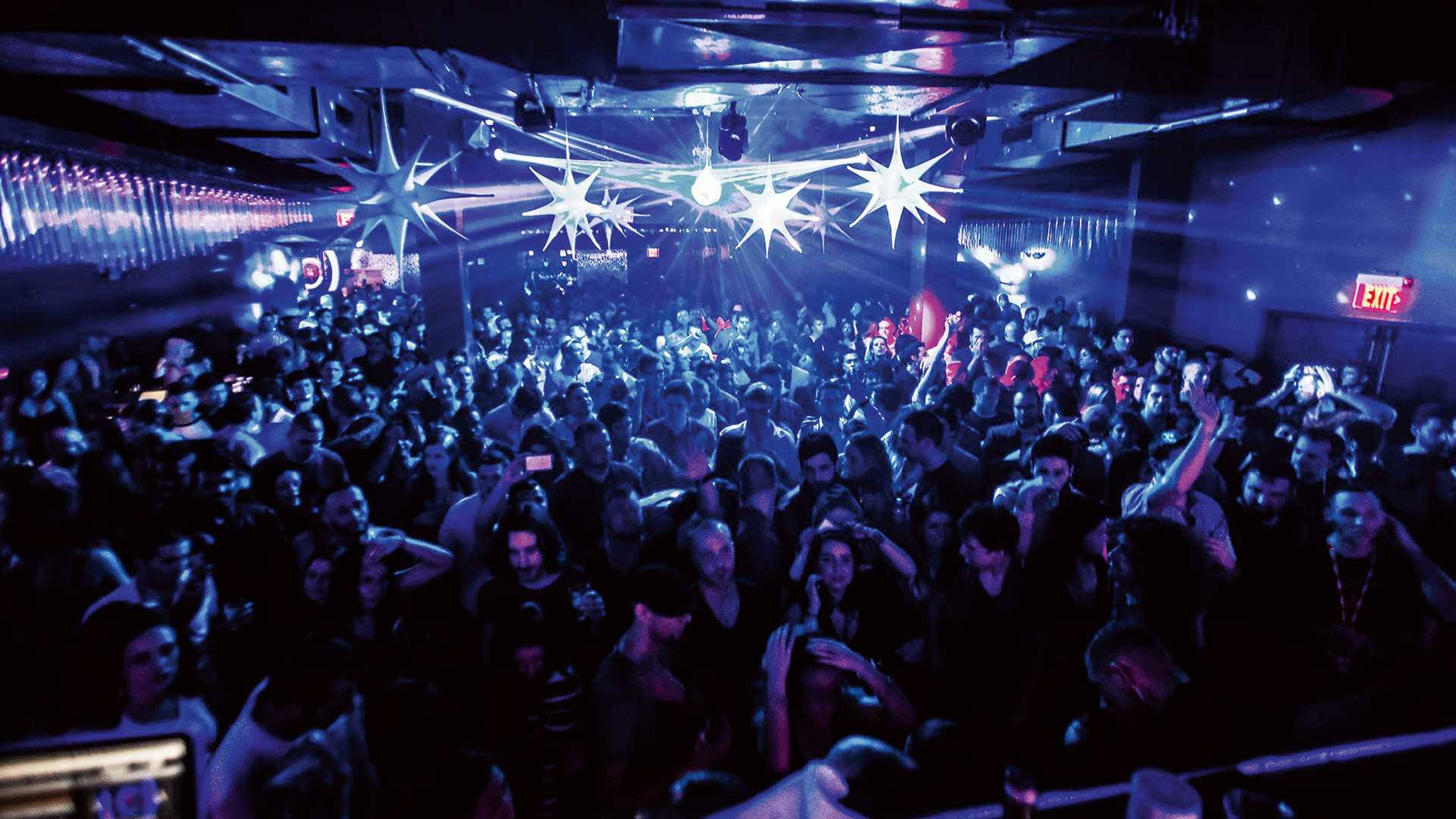Vibrant Nightlife At High-end Nightclub Background