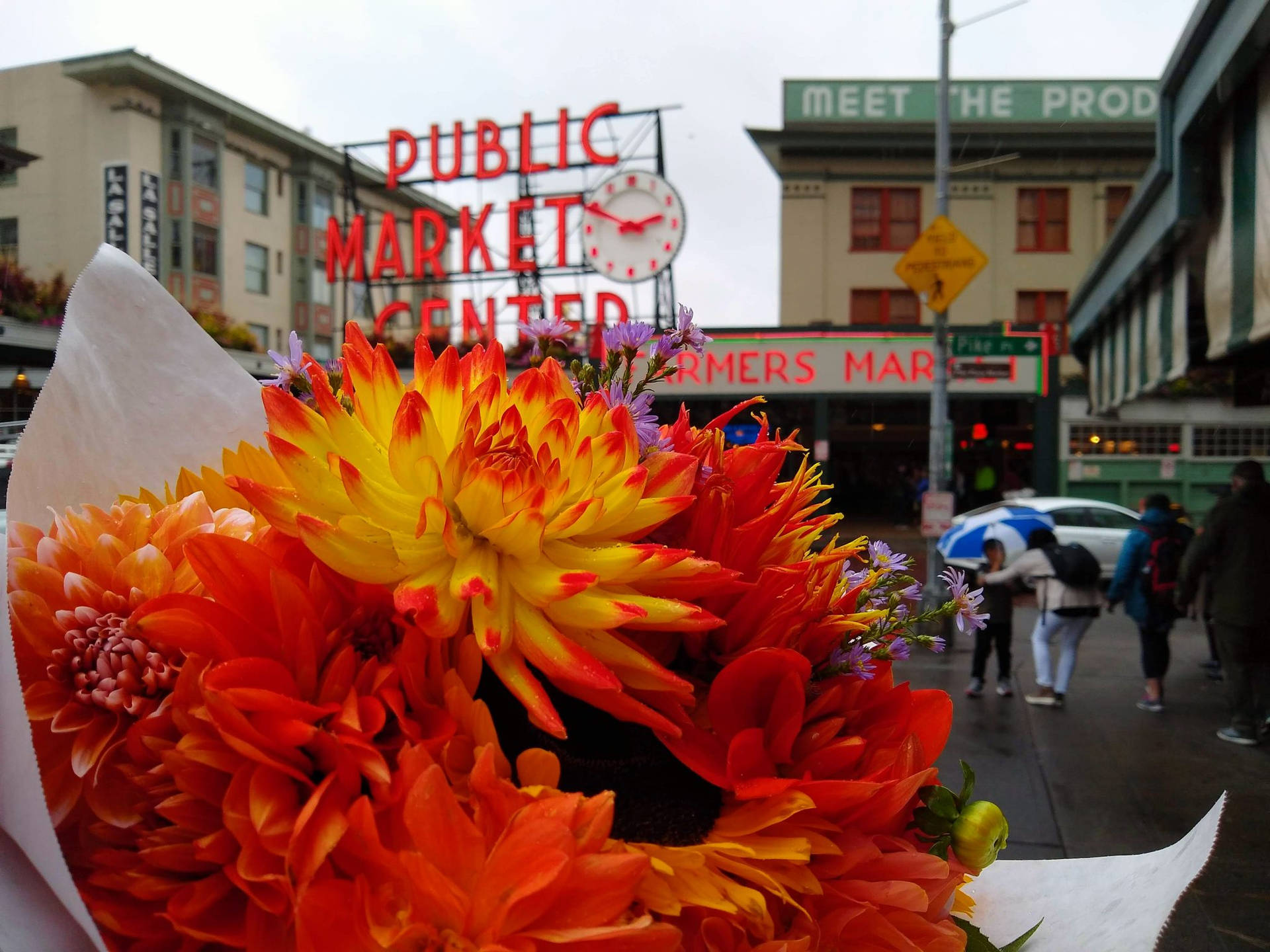 Vibrant Orange Flower Bouquet At Pike Place Market Background