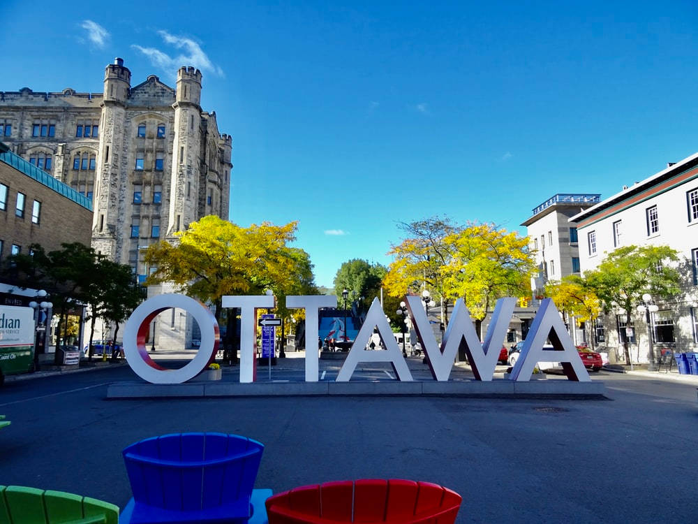 Vibrant Ottawa Sign In The Historic Byward Market Background