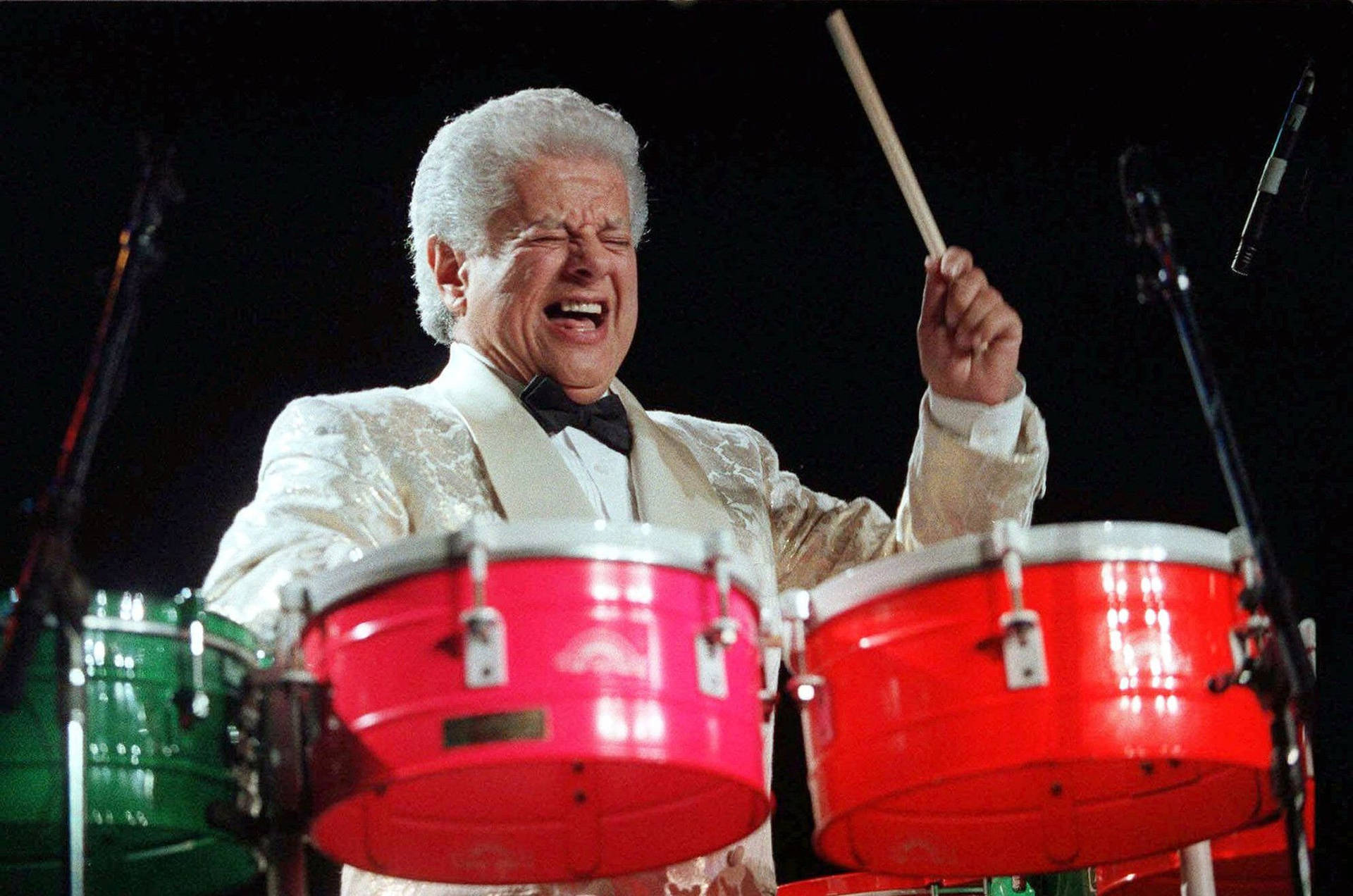 Vibrant Persona Of Tito Puente, The Latin Music Maestro Background