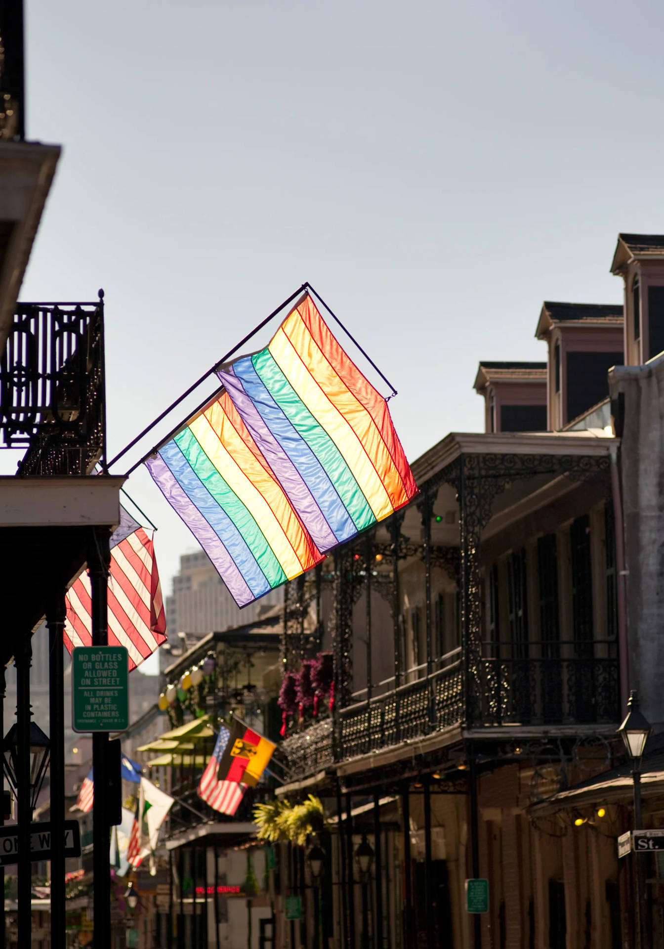 Vibrant Pride Flag Over New Orleans Skyline Background