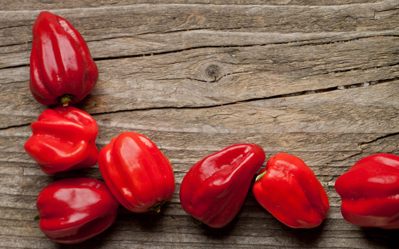 Vibrant Red Chili Peppers On Rustic Wooden Surface Background