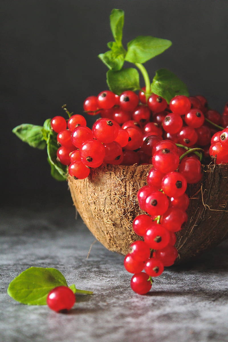 Vibrant Red Currant Berries In A Coconut Bowl