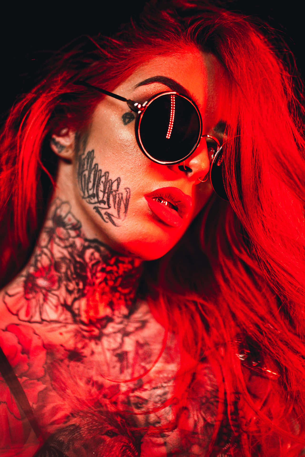 Vibrant Red Glow On A Neck Tattoo Background