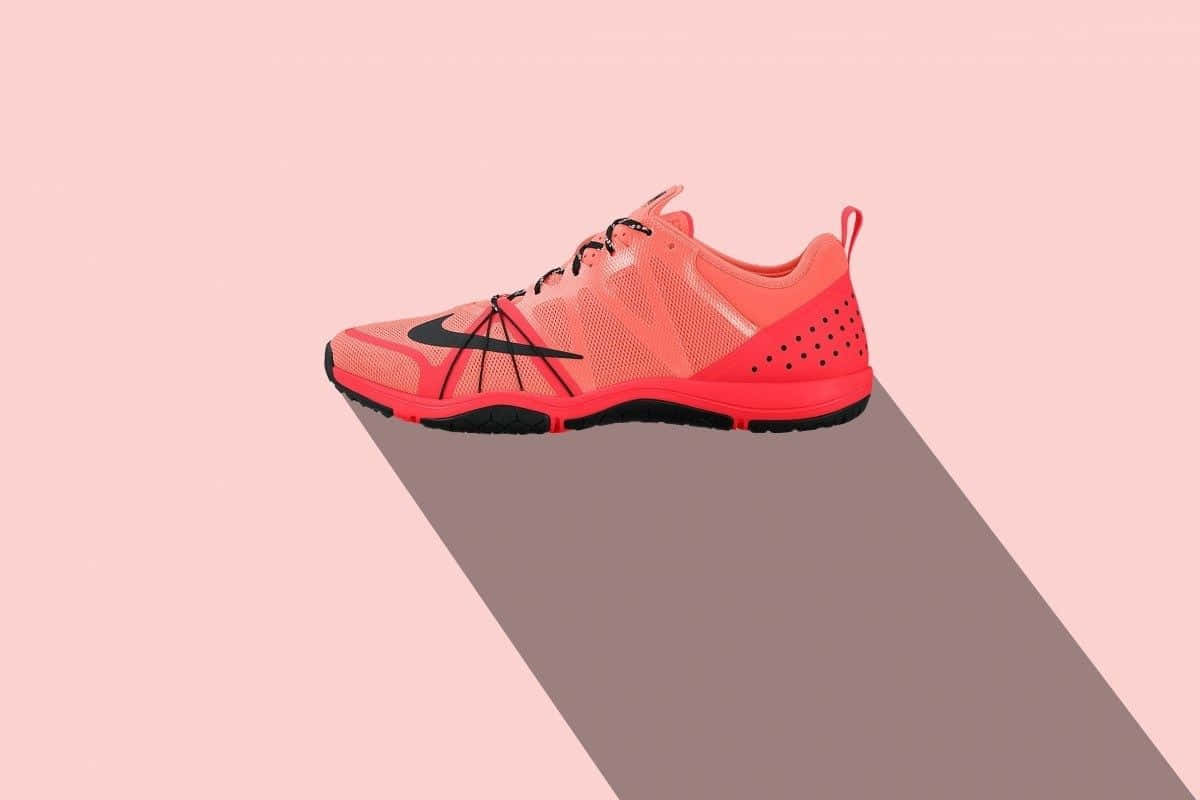 Vibrant Red Nike Sneakers – Style In Motion Background