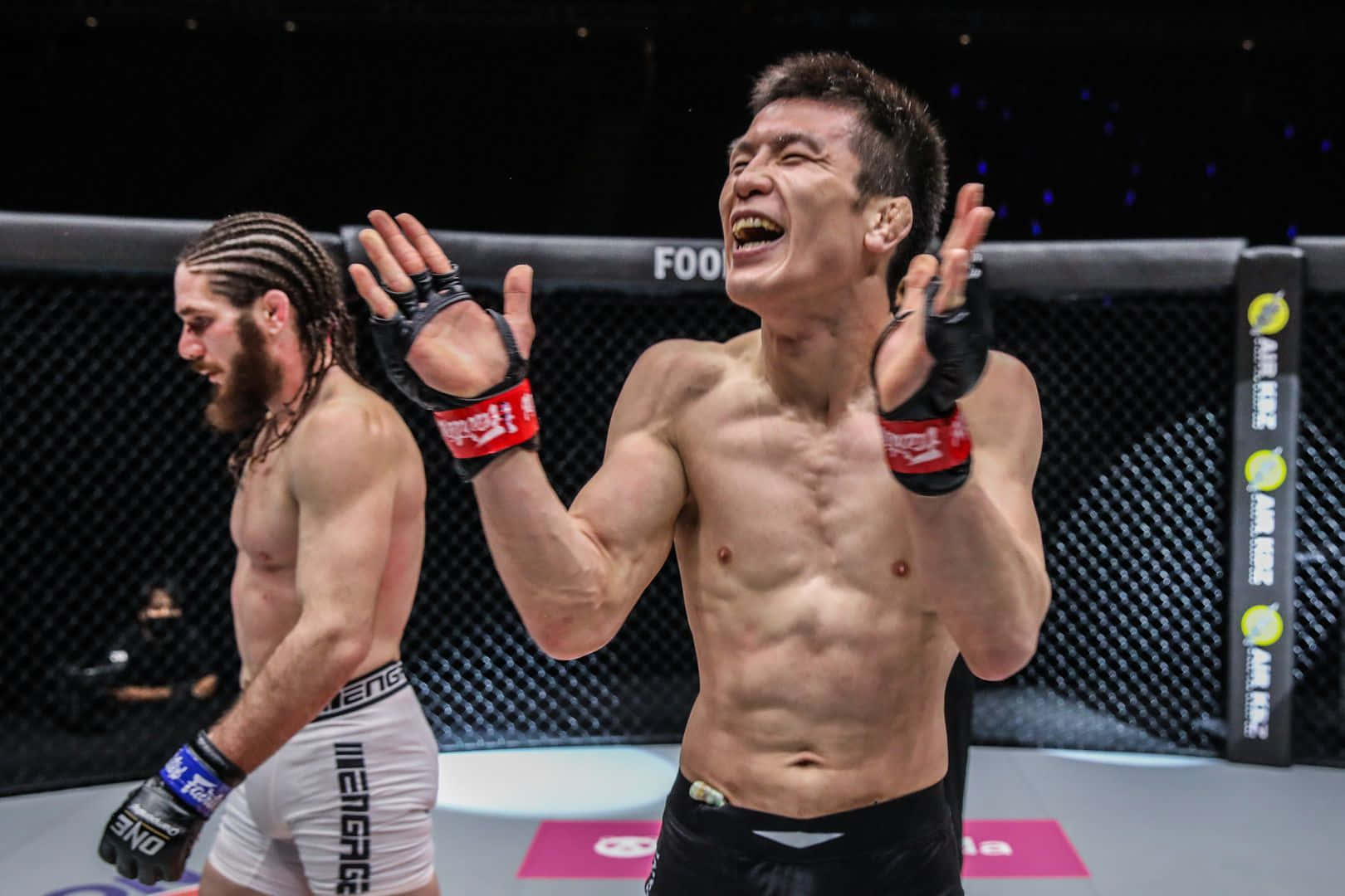 Vibrant Shot Of Shinya Aoki Applauding Background