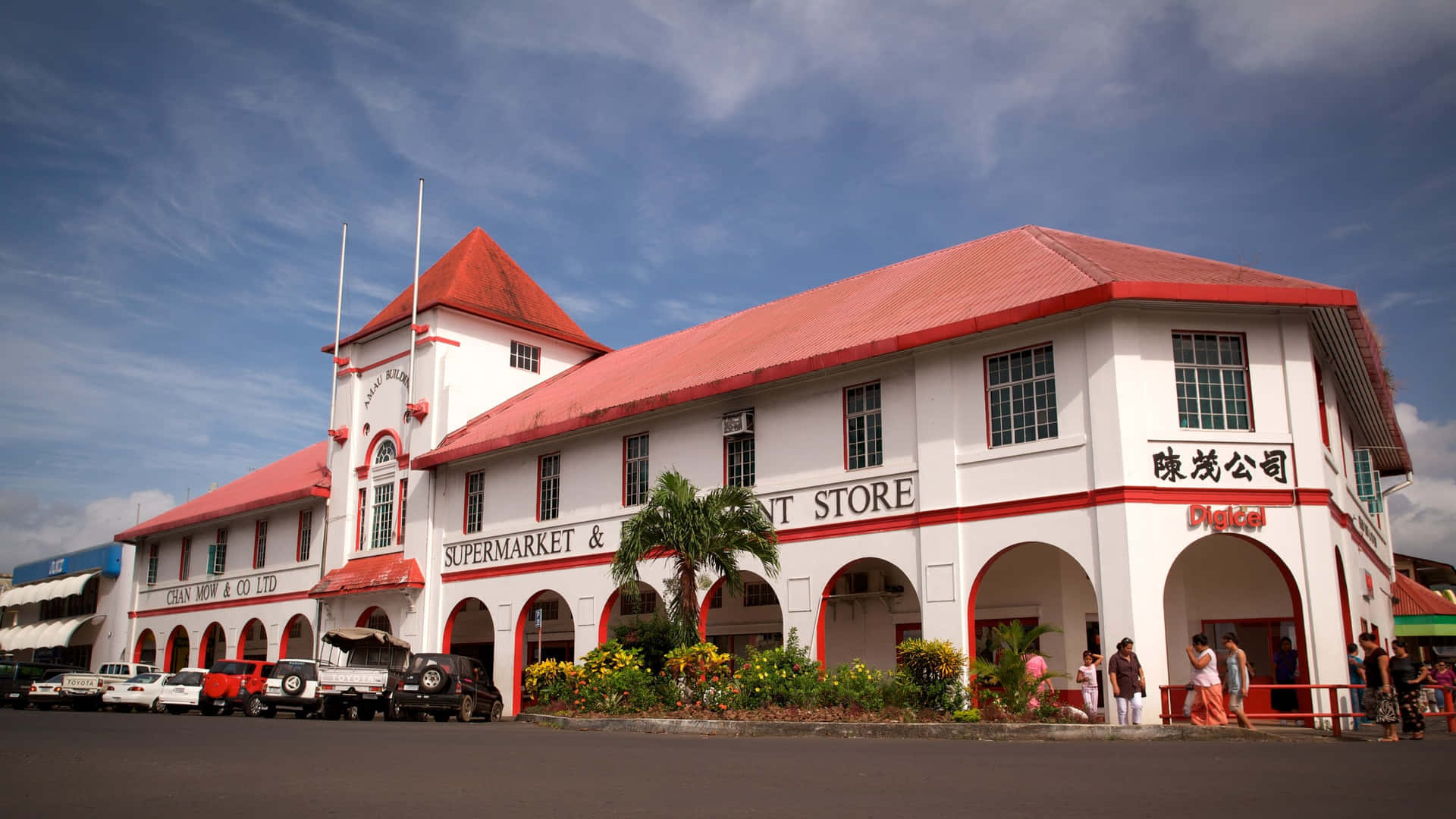 Vibrant View Of The Chan Mow Supermarket Complex In Apia Background