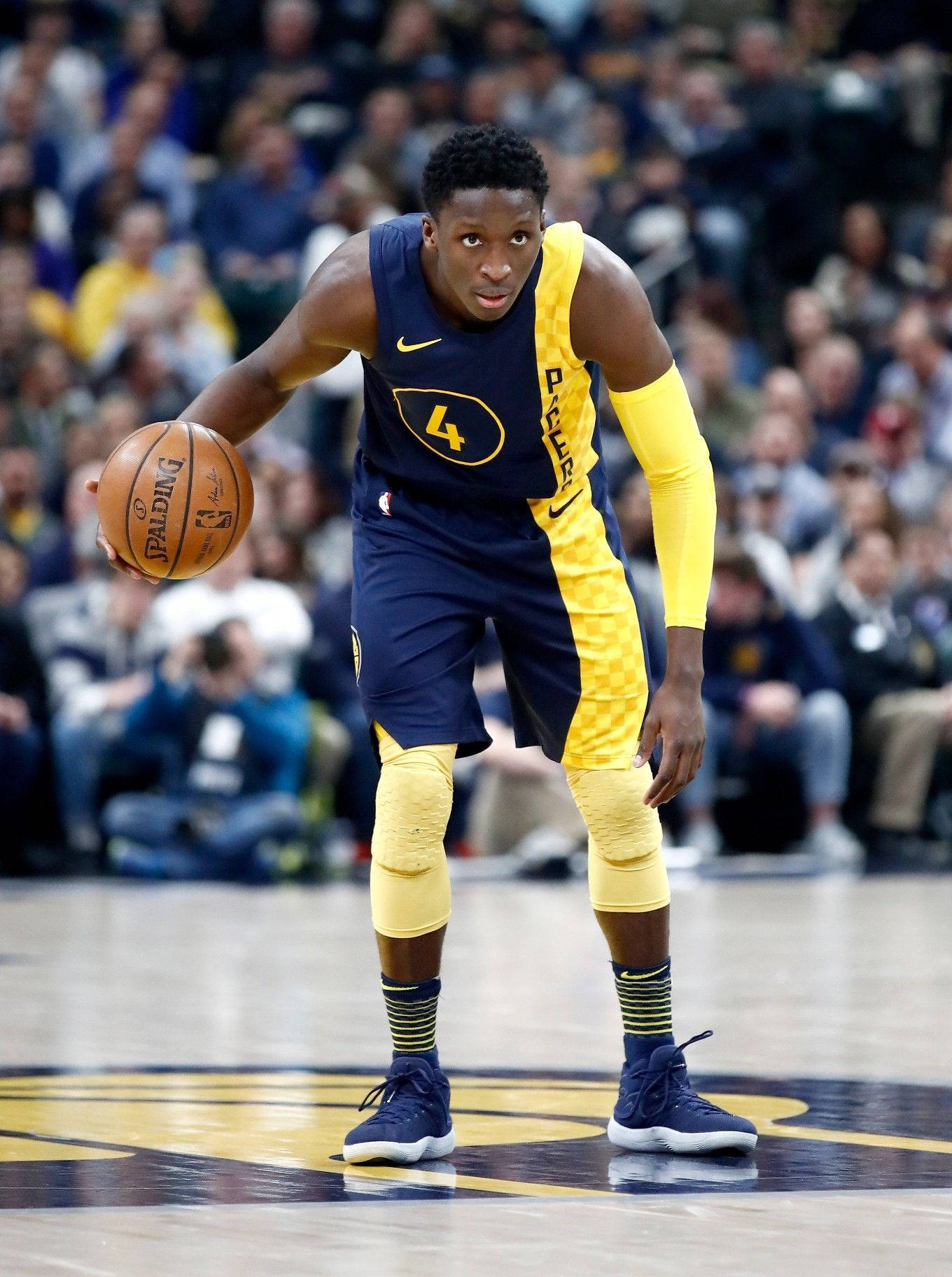 Victor Oladipo In Yellow Blue Jersey Background