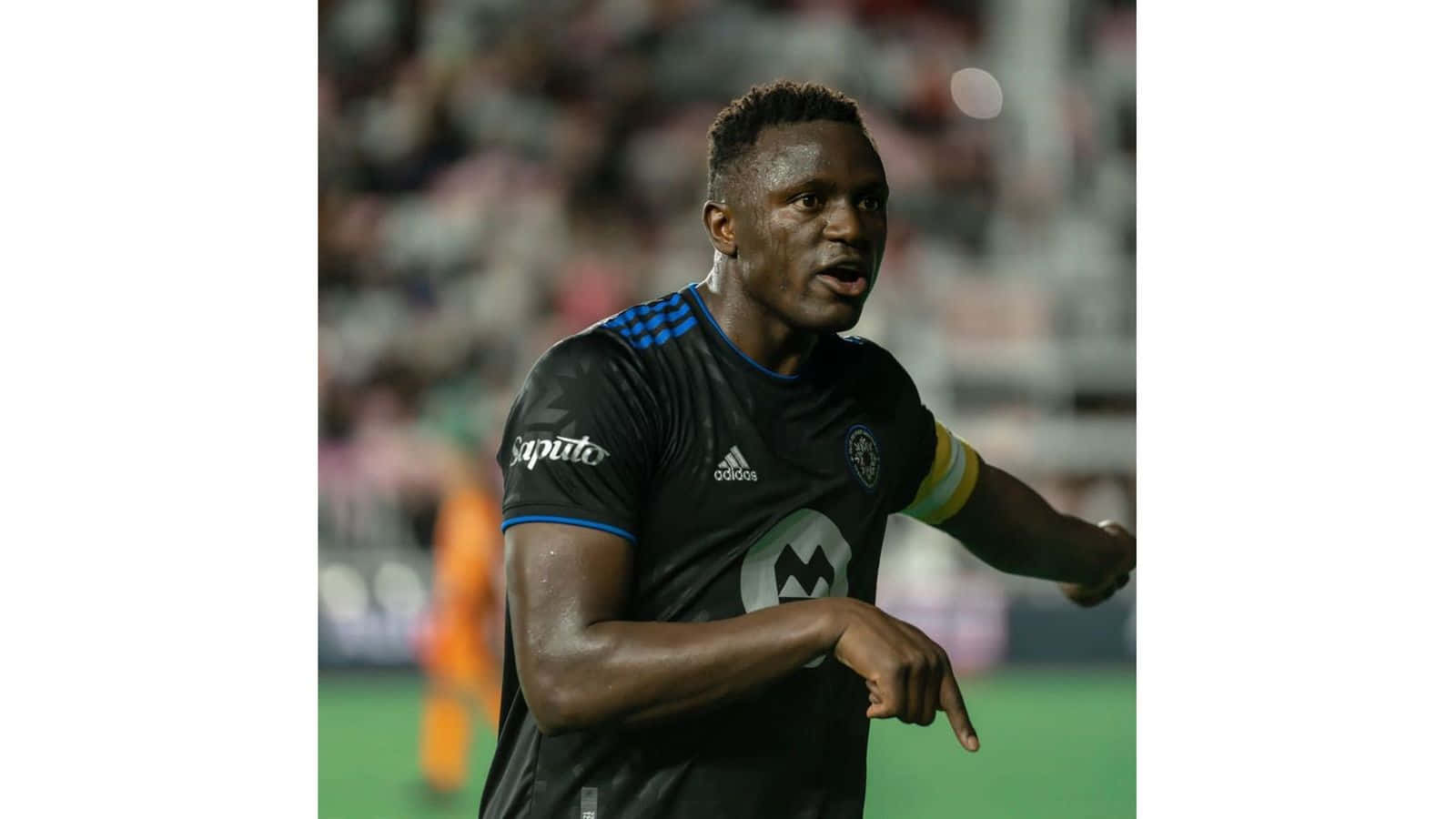 Victor Wanyama Football Player Pointing Finger Background