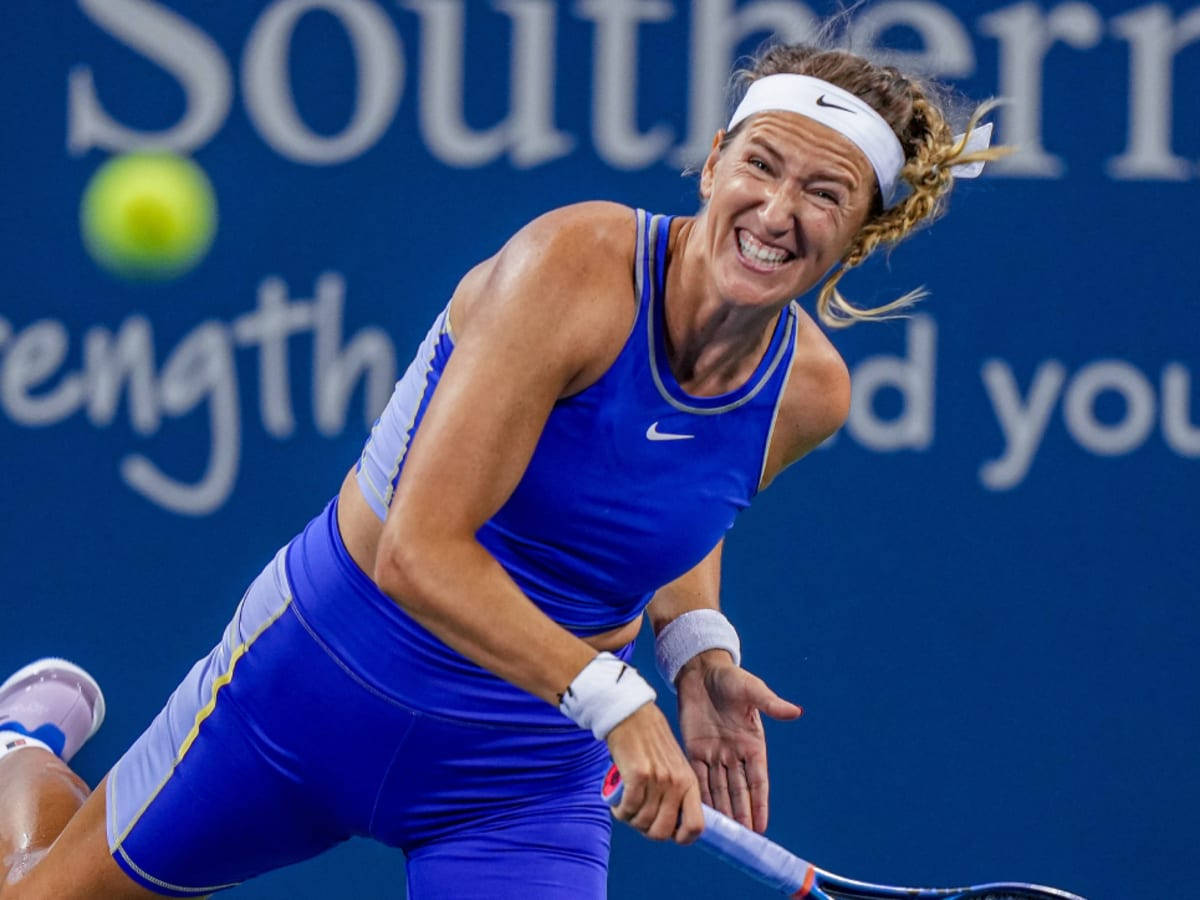 Victoria Azarenka In Blue Hitting Ball