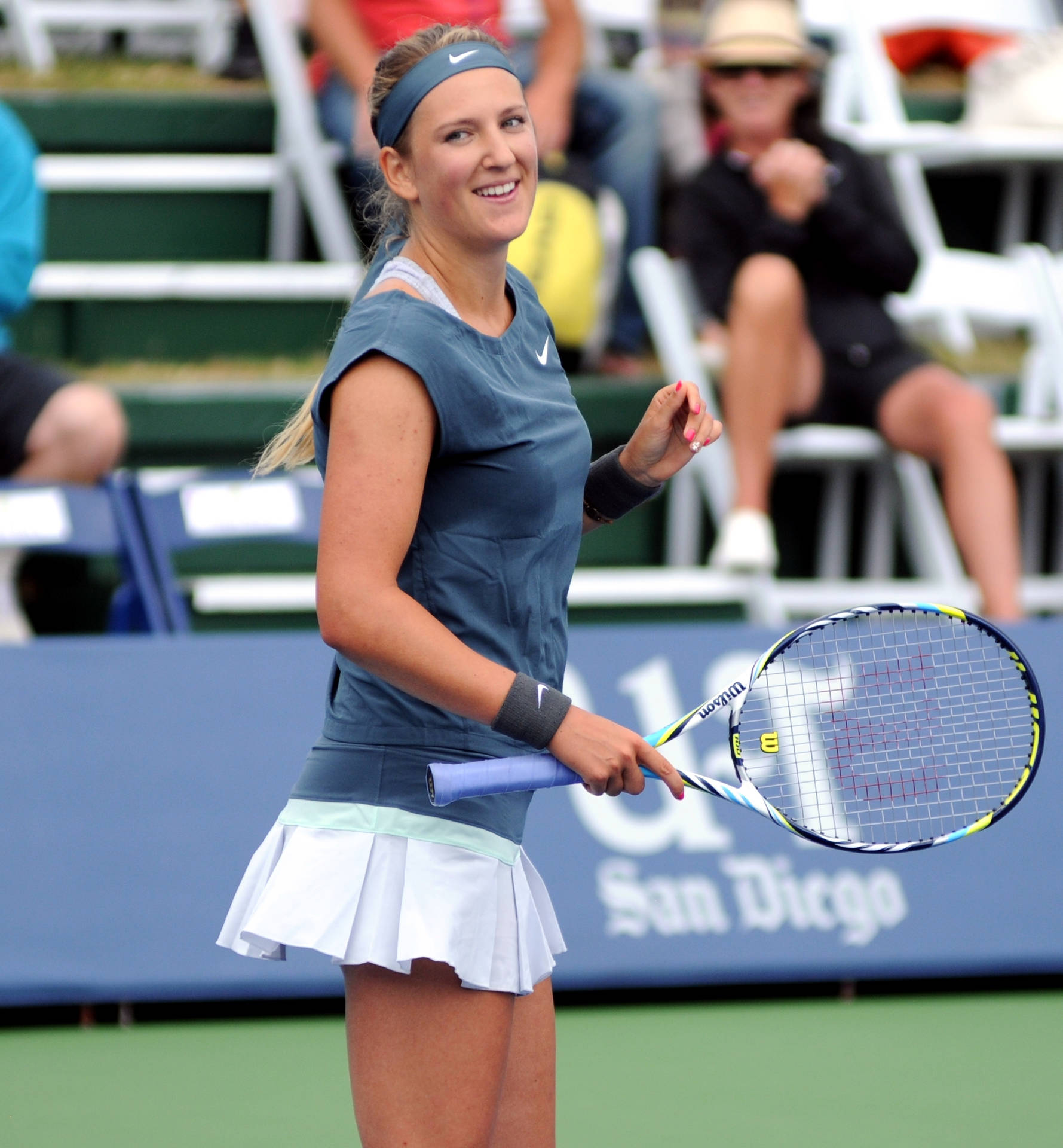 Victoria Azarenka Smiling In Gray Background