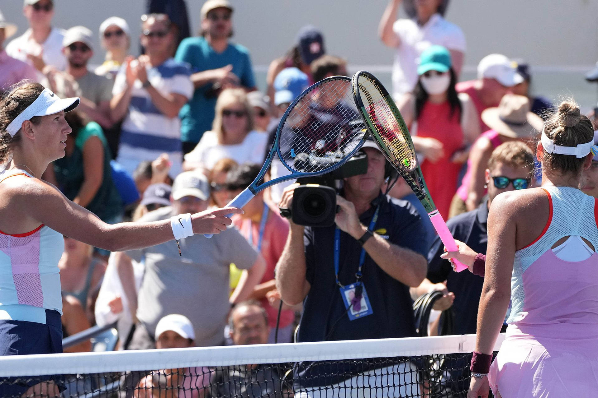 Victoria Azarenka Touching Rackets With Opponent Background