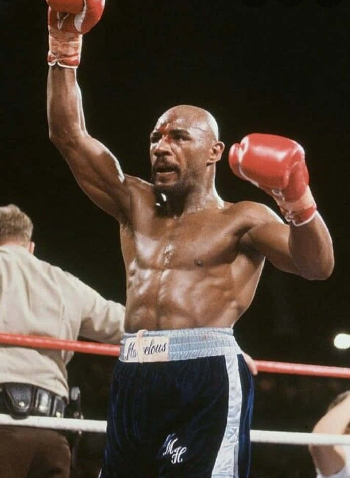 Victorious Boxer Raising Fist Background