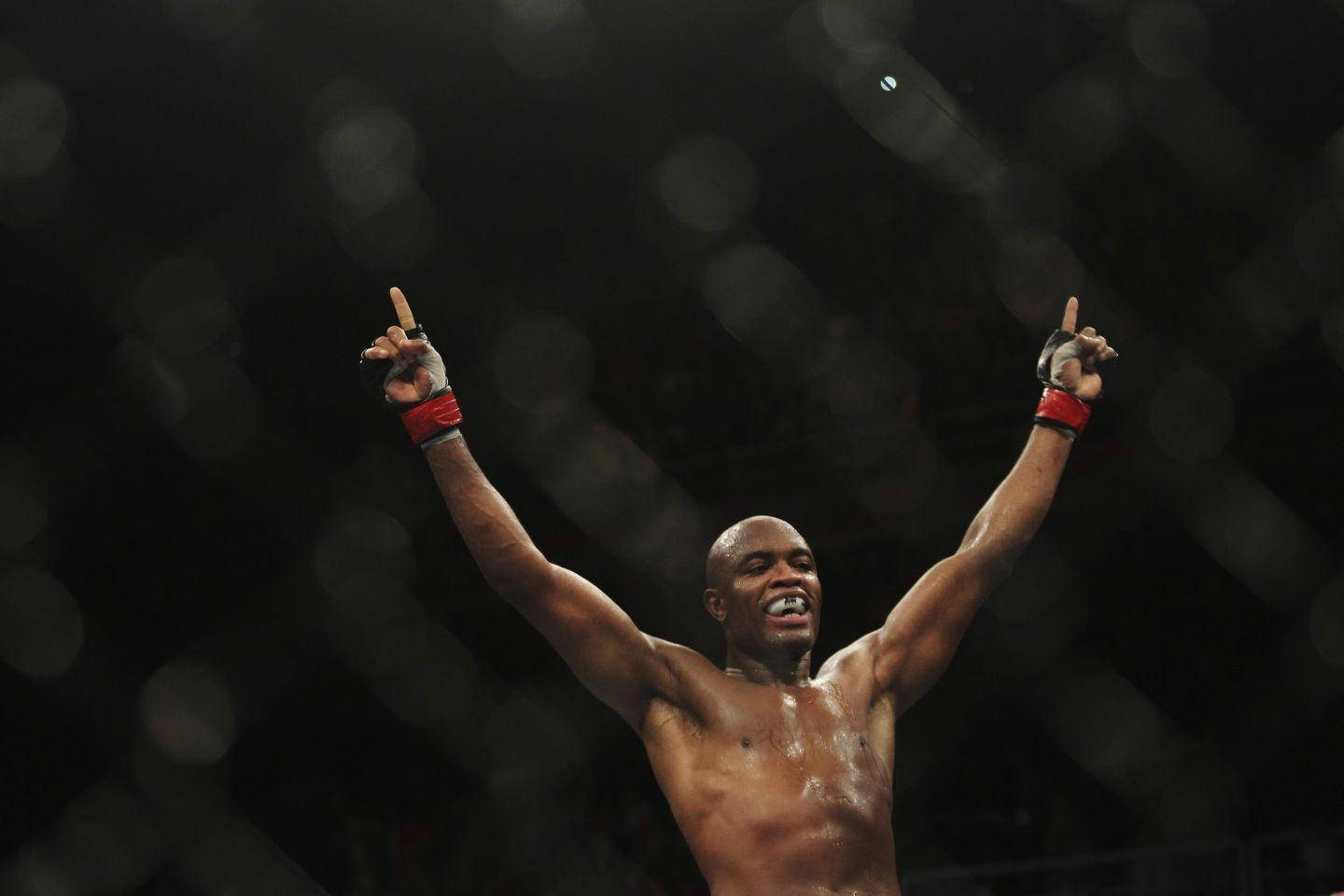 Victorious Look Of Anderson Silva Pointing Upwards Background