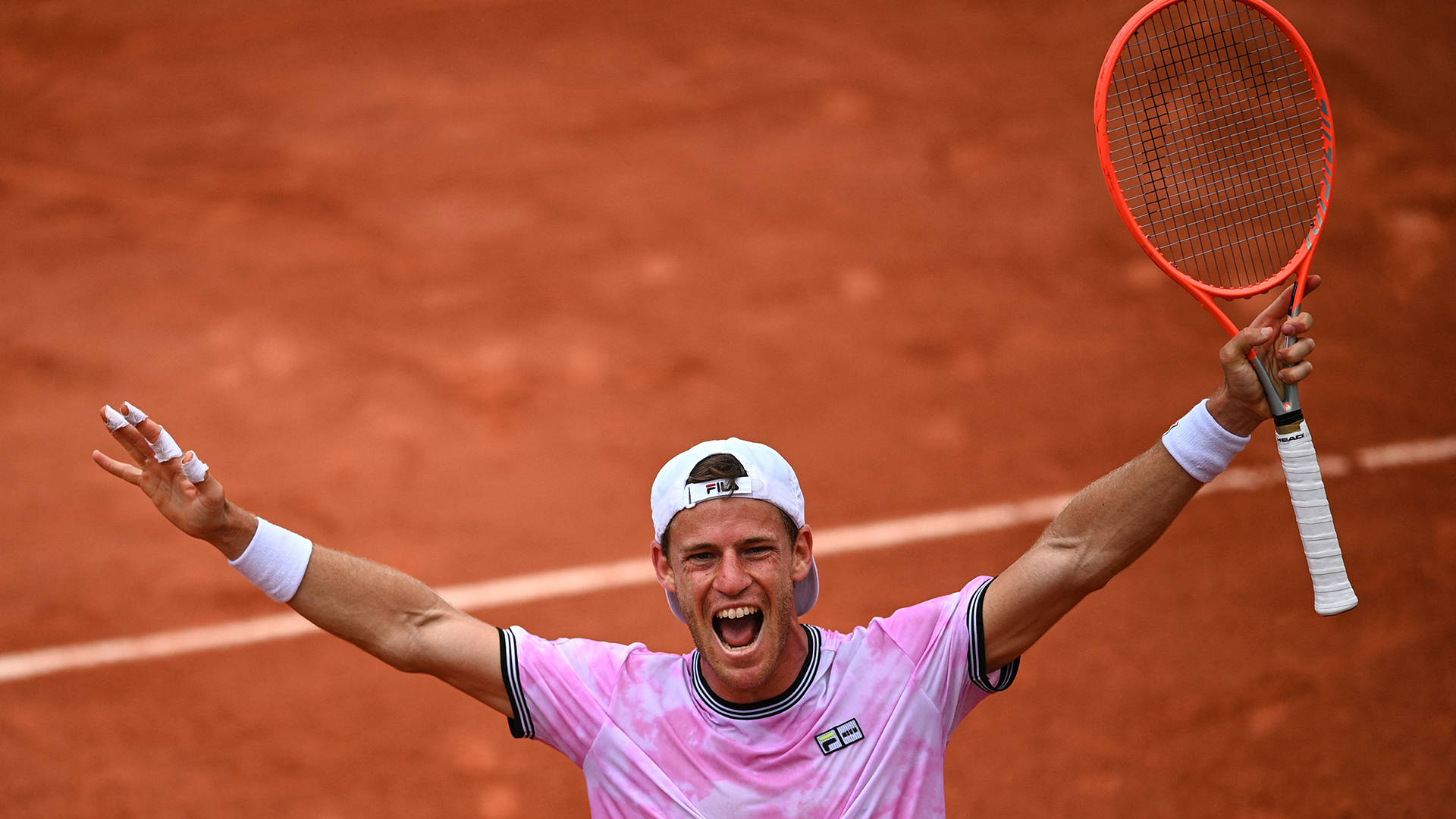 Victorious Moment: Diego Schwartzman Celebrating A Win Background