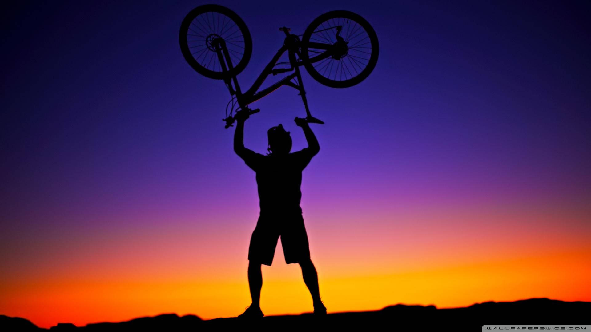 Victory Pose With A Bicycle Background