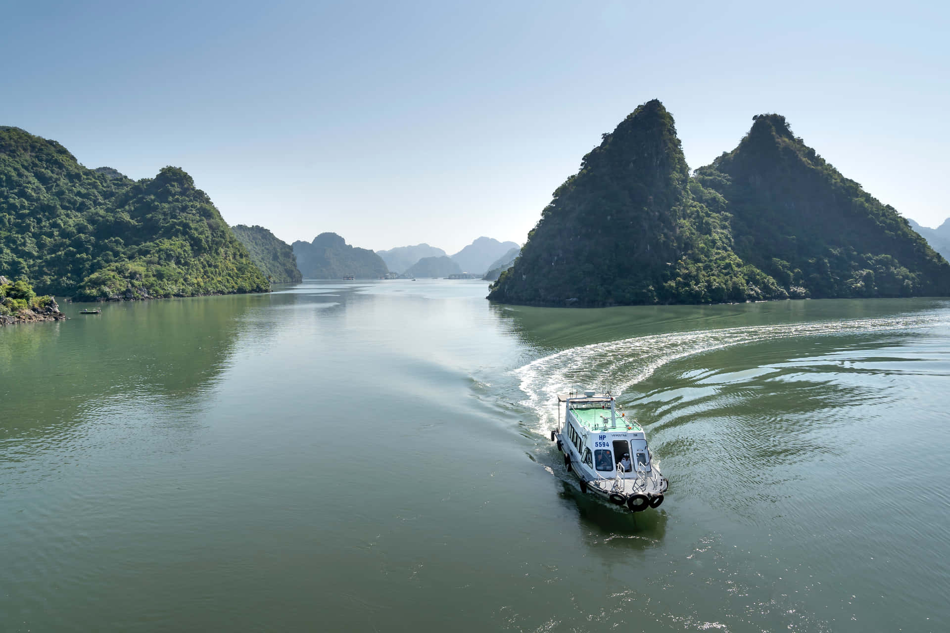 Vietnam's Halong Bay With Speedboat Background